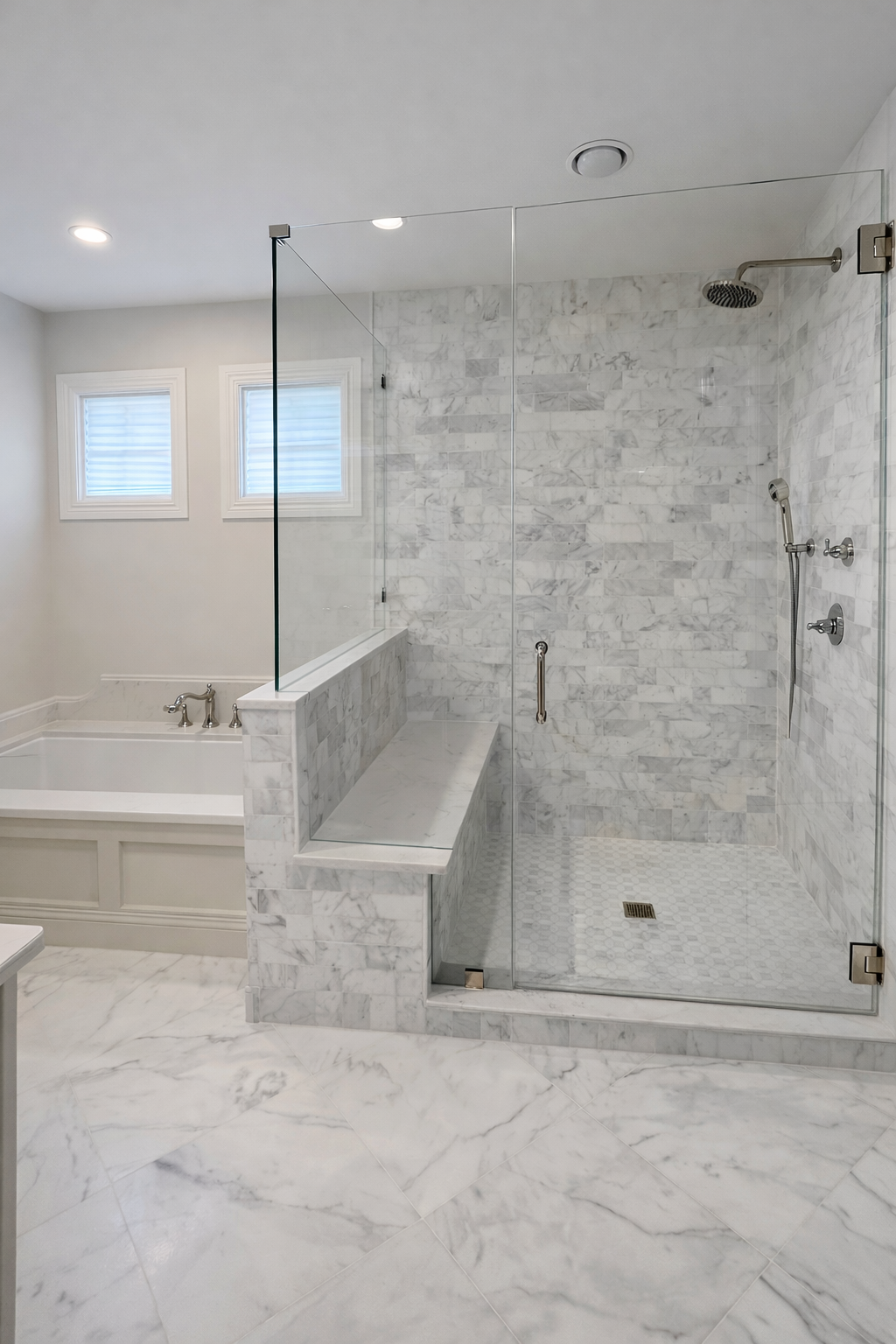 Modern bathroom with marble tiles, a glass-enclosed shower, a bathtub, and two small windows.