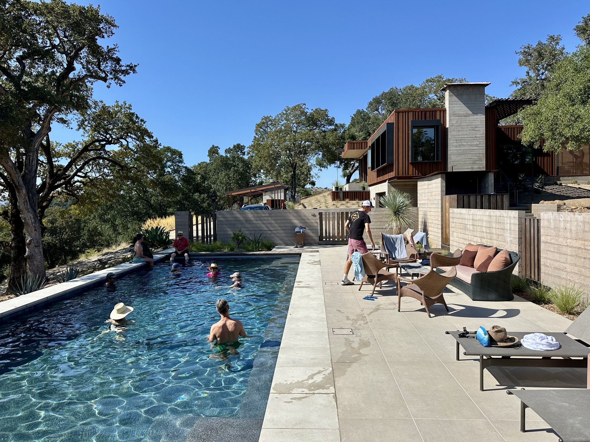An image of the pool and home.