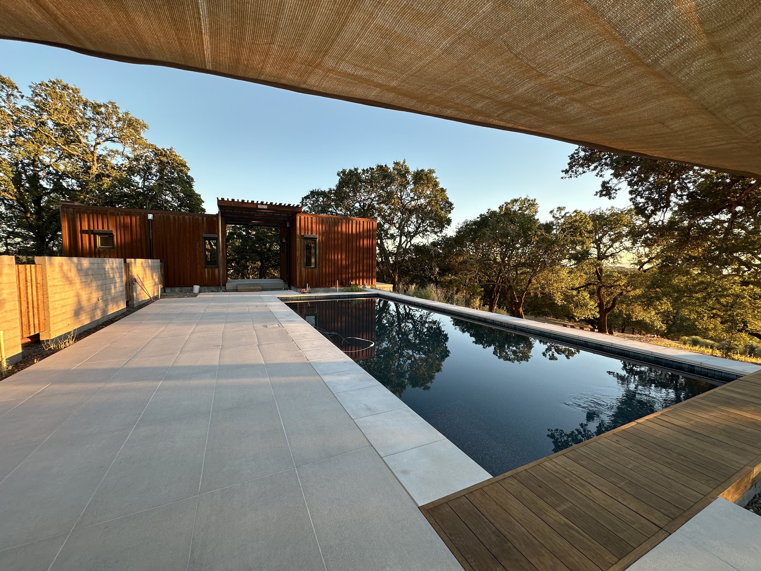 view of pool and guesthouse