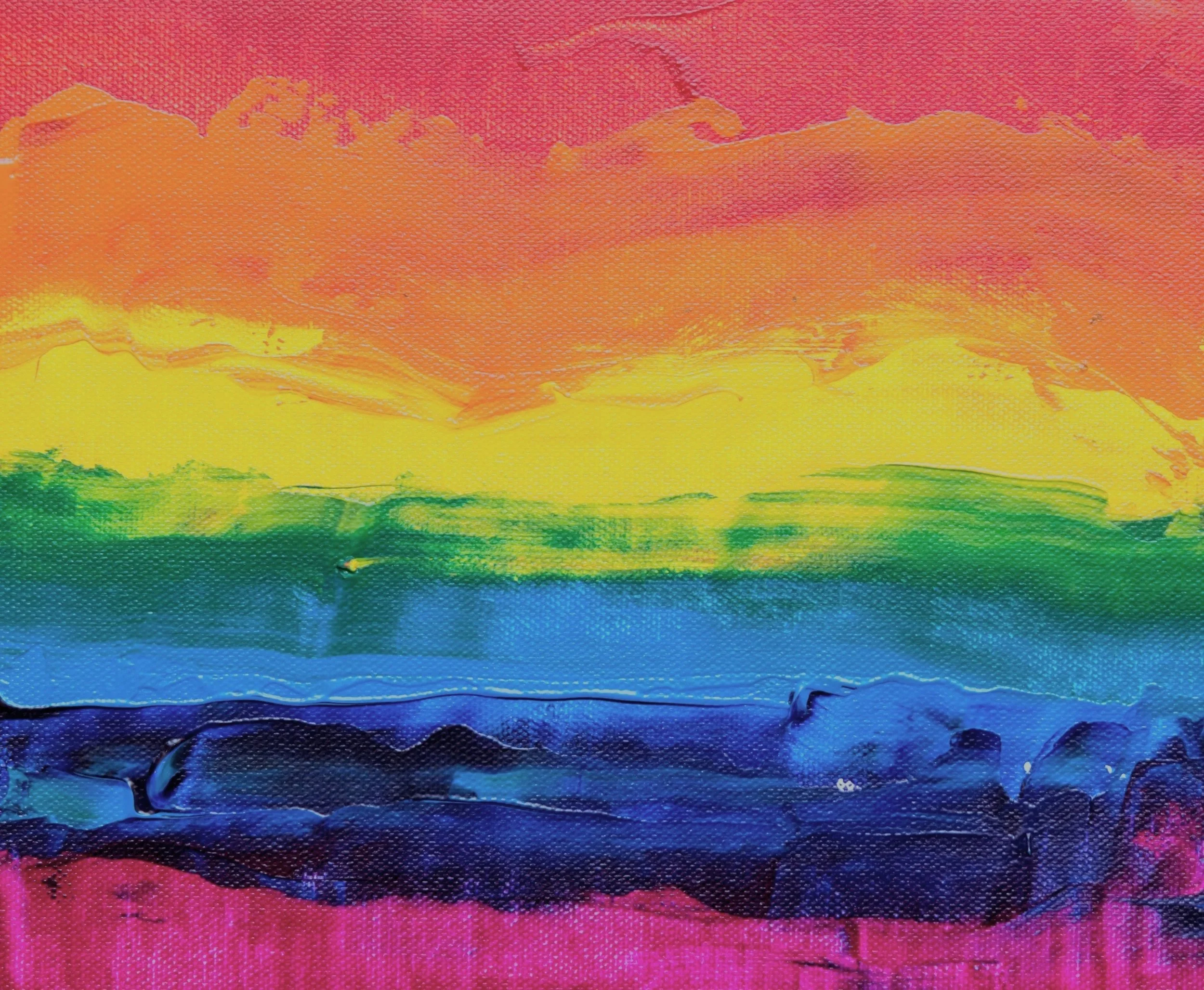 Watercolor painting of a sunset over mountains with a layered rainbow sky in vibrant colors.
