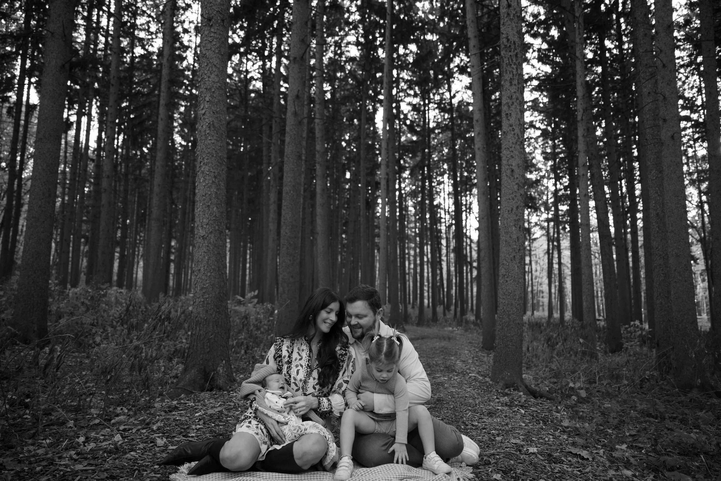 sitting on a blanket family of four at Morton Arboretum Lisle IL 