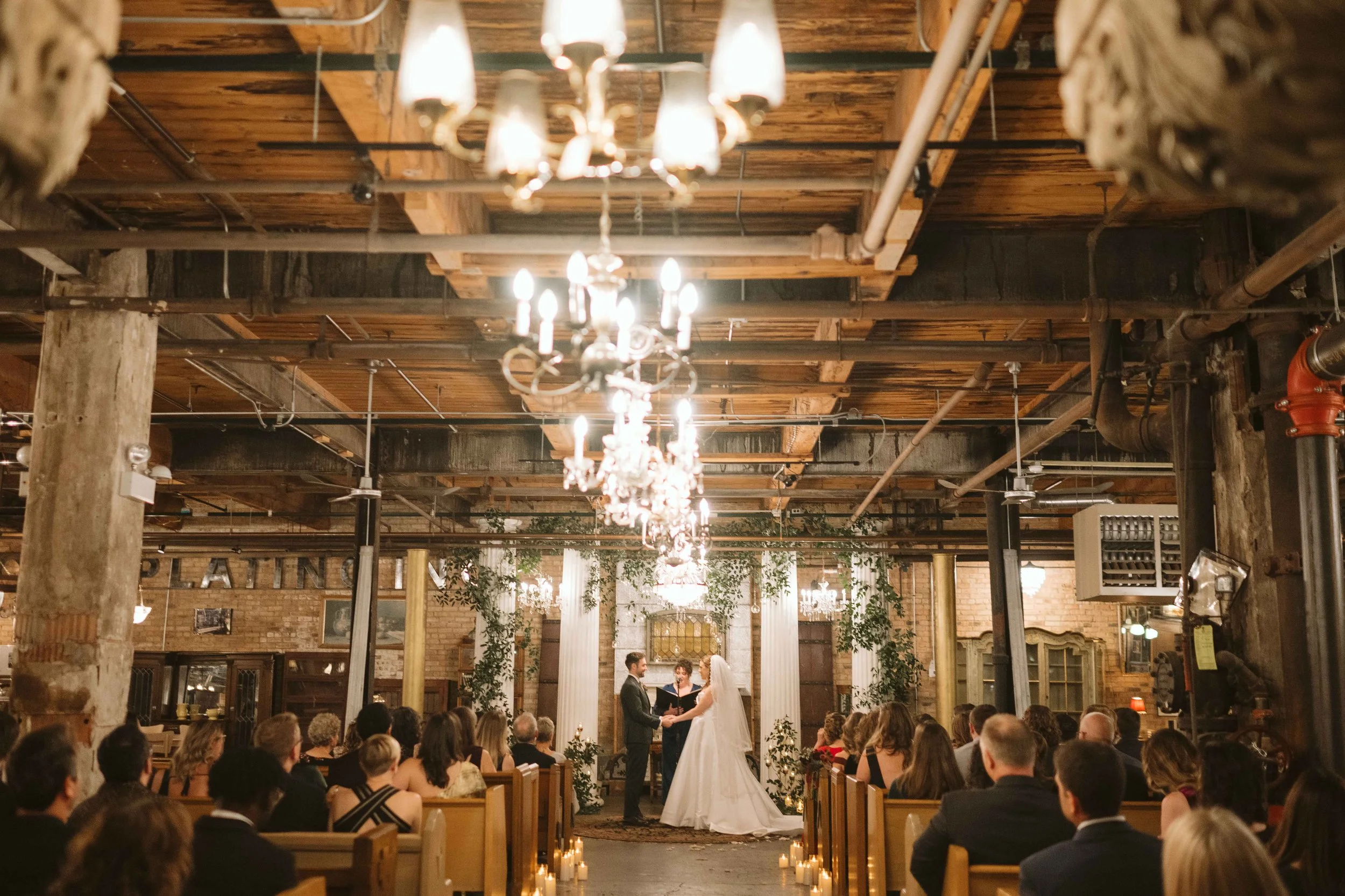 Salvage One wedding ceremony in Chicago IL wide shot of everyone seated