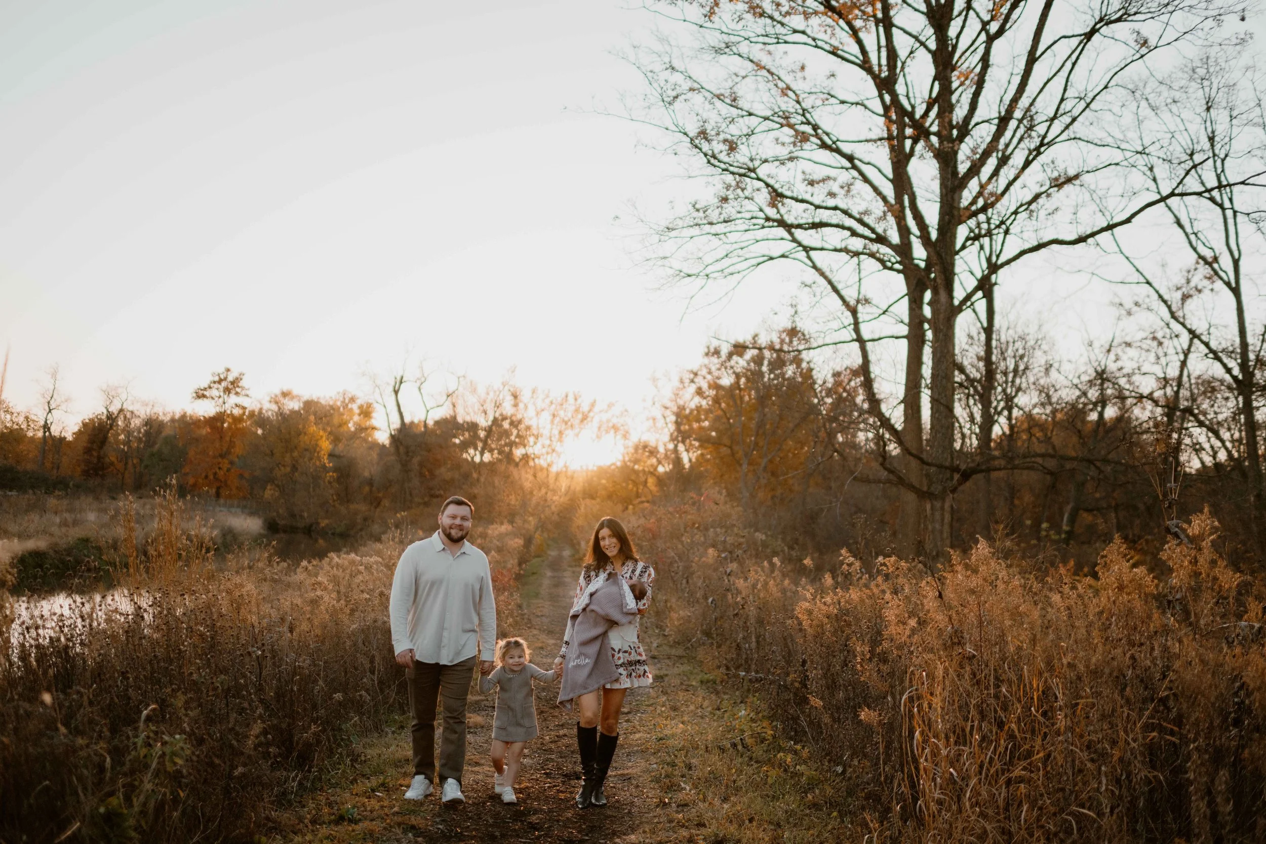 sunset family of four walking at the Morton Arboretum Lisle IL 