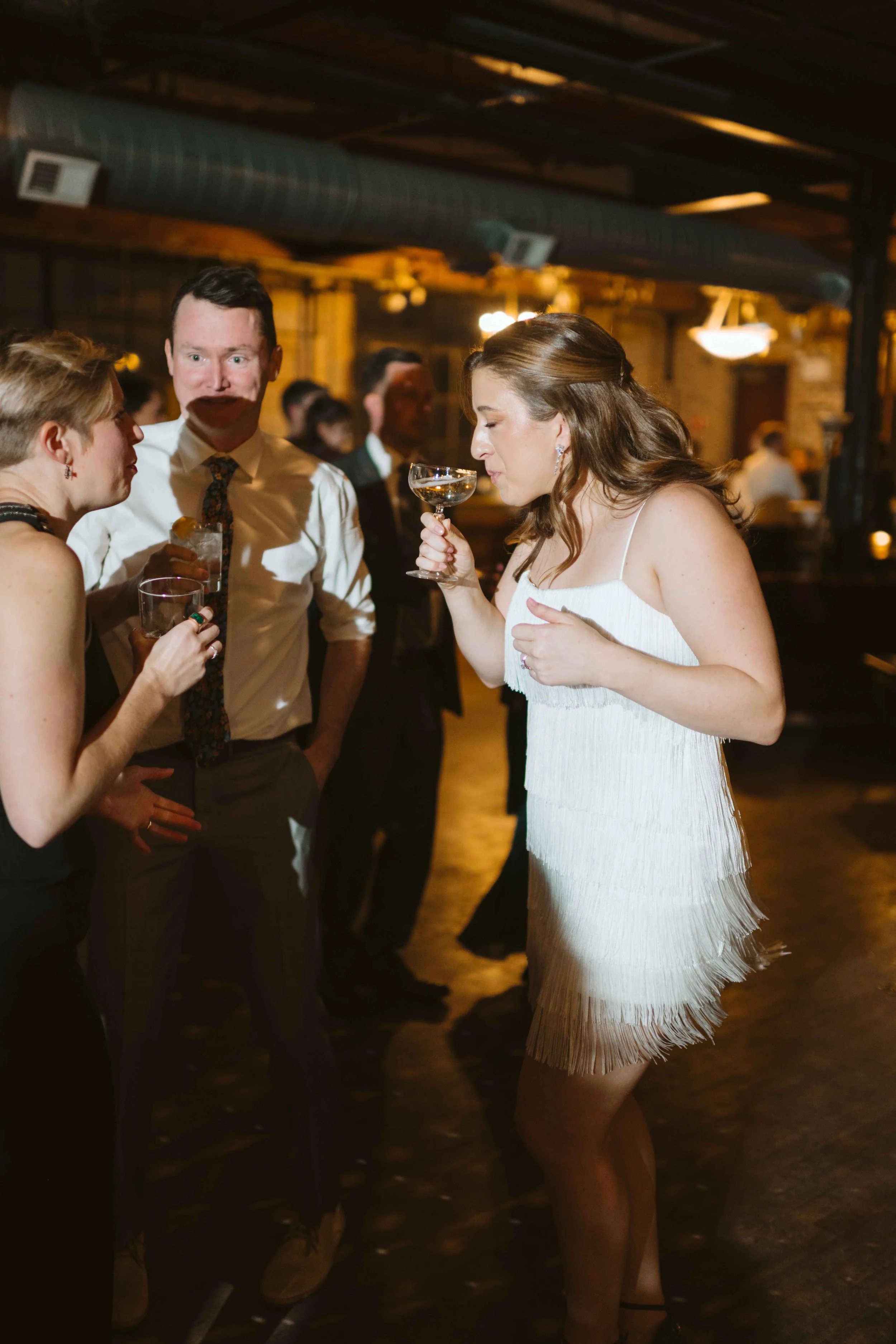 salvage one chicago il wedding reception bride sipping champagne