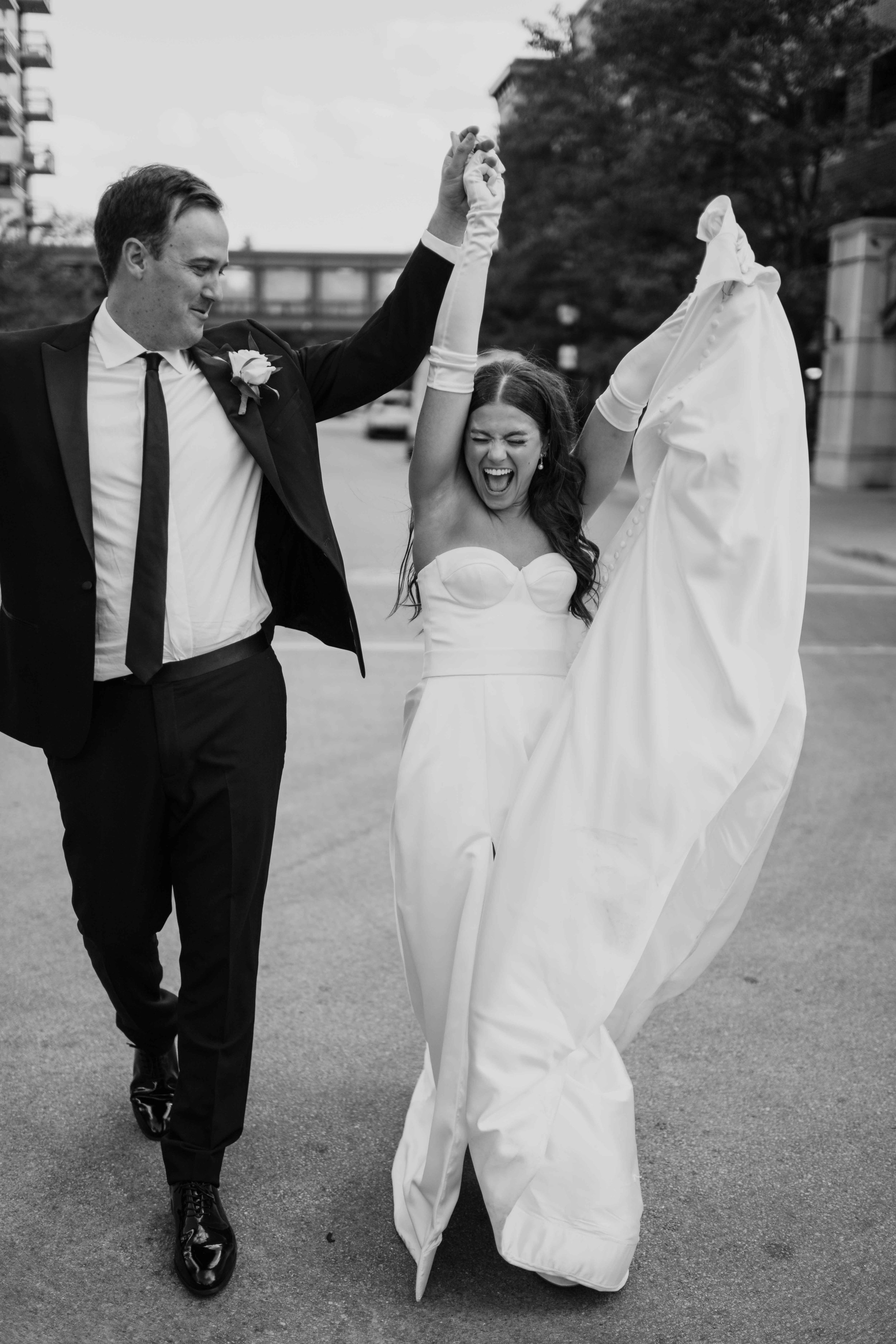 Chicago suburb wedding with a couple cheering as they walk into the reception