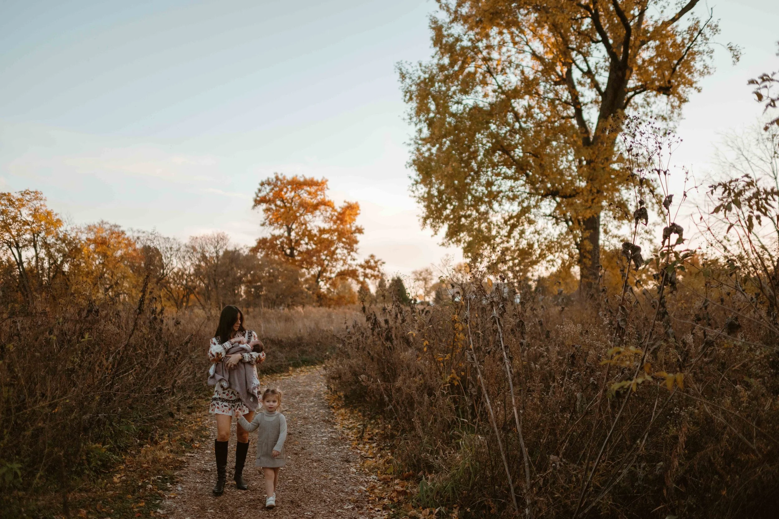 mom and two daughters on a walk at sunset at the Morton Arboretum Lisle IL 