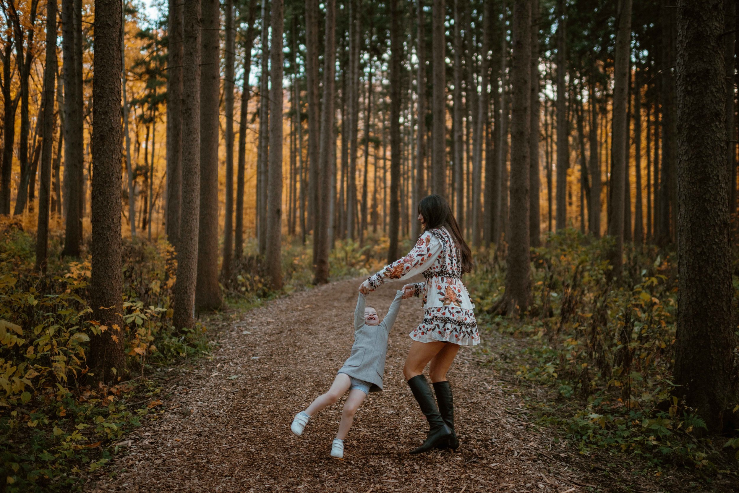 mommy swinging daughter at family photos at Morton Arboretum Lisle IL 