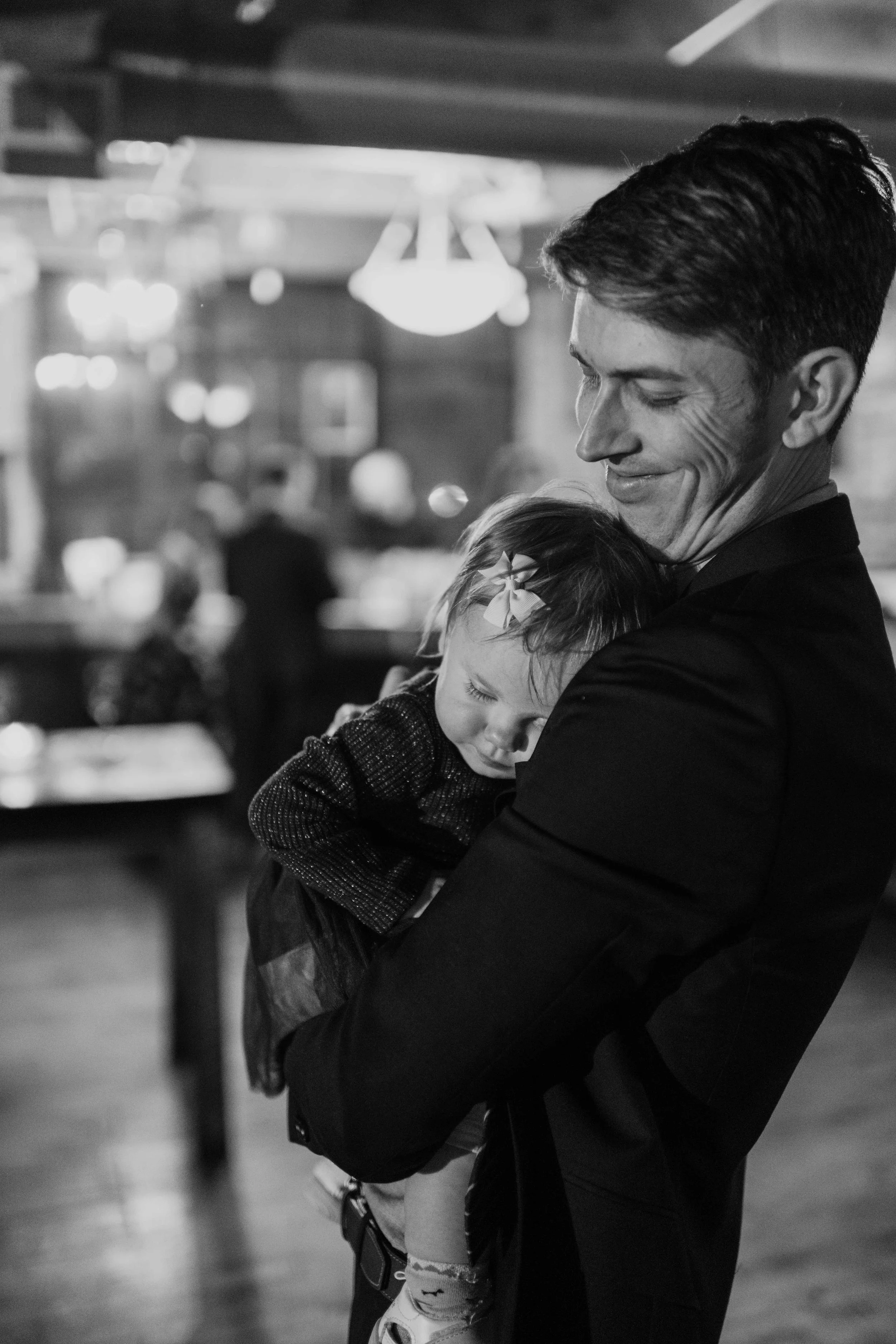 salvage one chicago candid shot of little girl sleeping at wedding reception