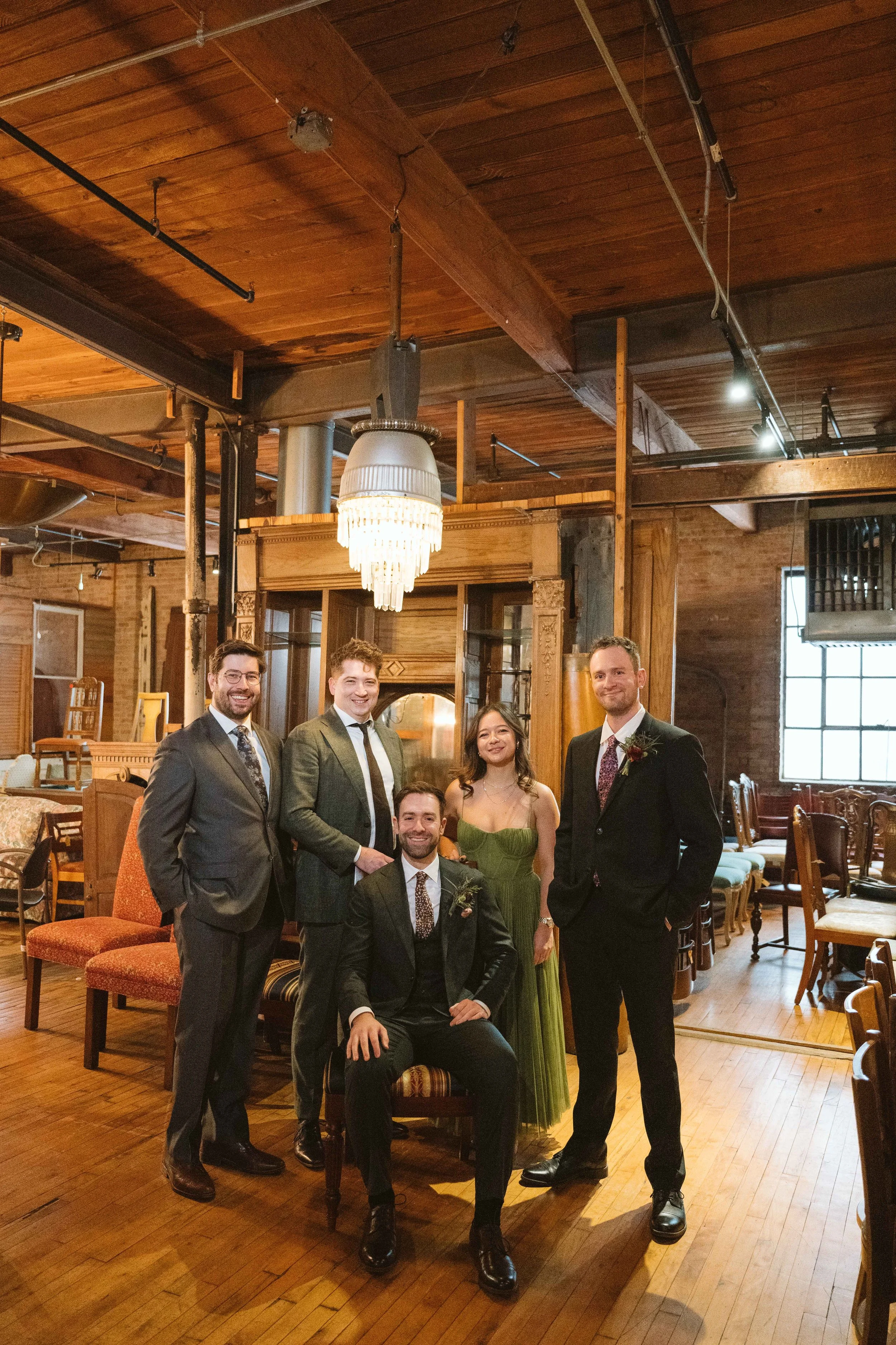 Groom and his groomsmen and bridesbro at Salvage One in Chicago