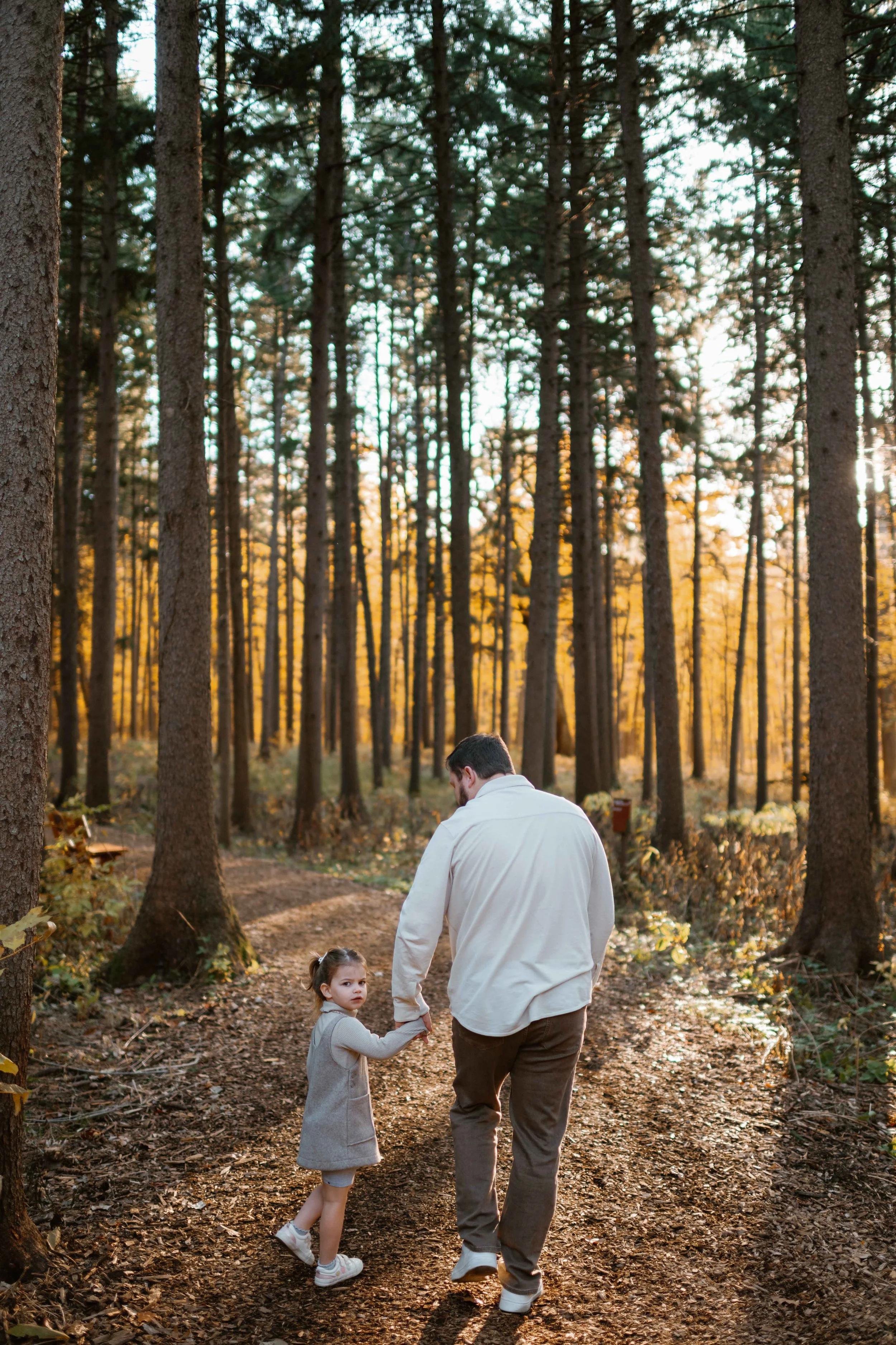 Morton Arboretum Lisle IL family photo walking in pathway with dad
