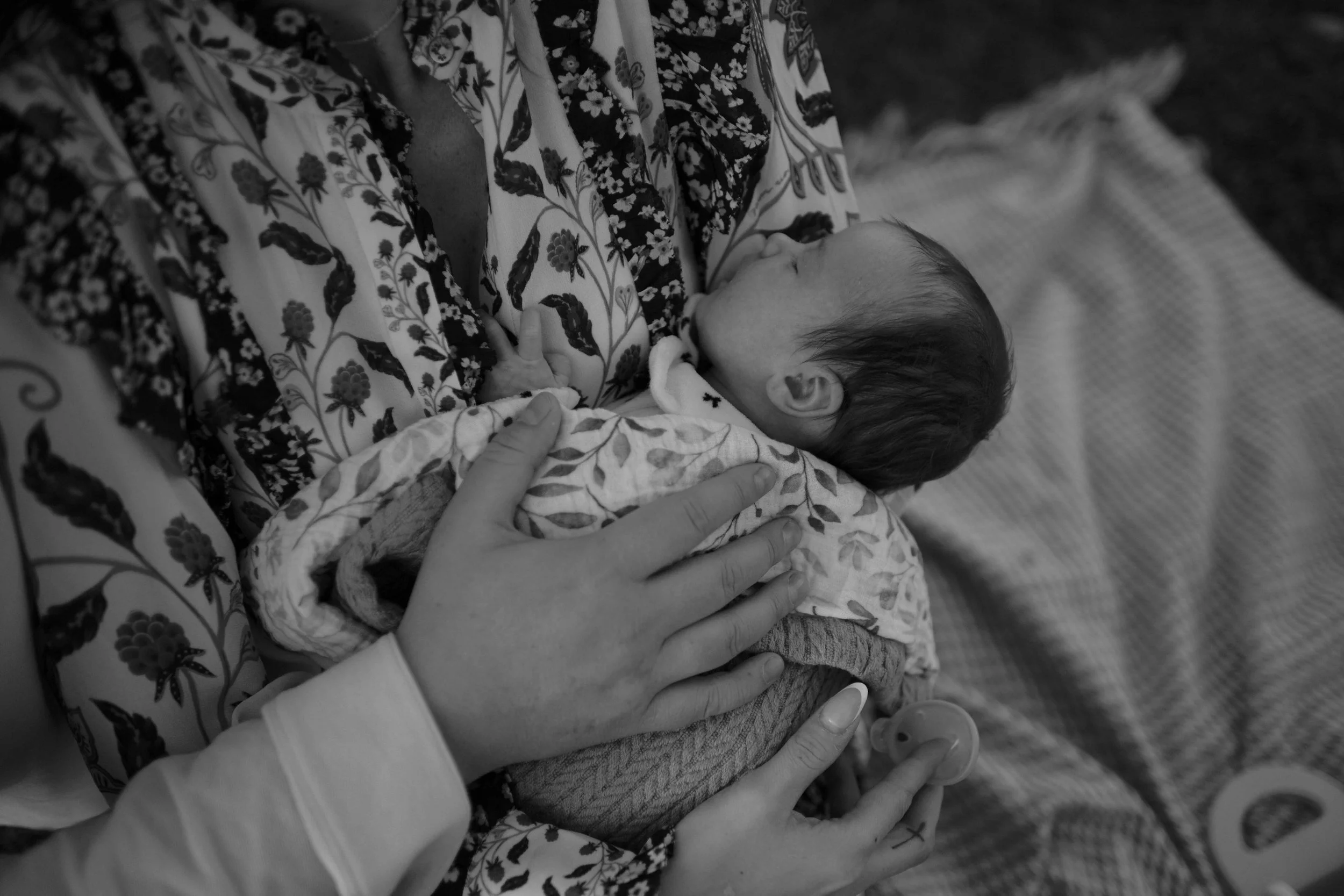close up black and white of newborn baby on mama's chest at Morton Arboretum Lisle IL 