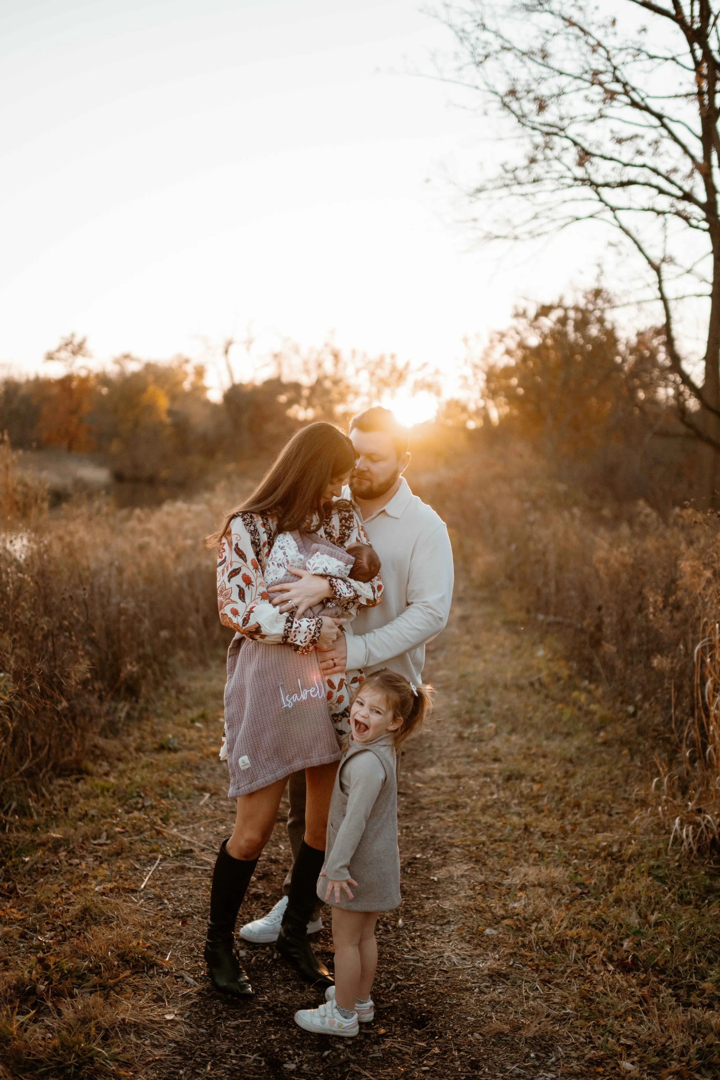 family of four nuzzle at sunset at the Morton Arboretum Lisle IL 