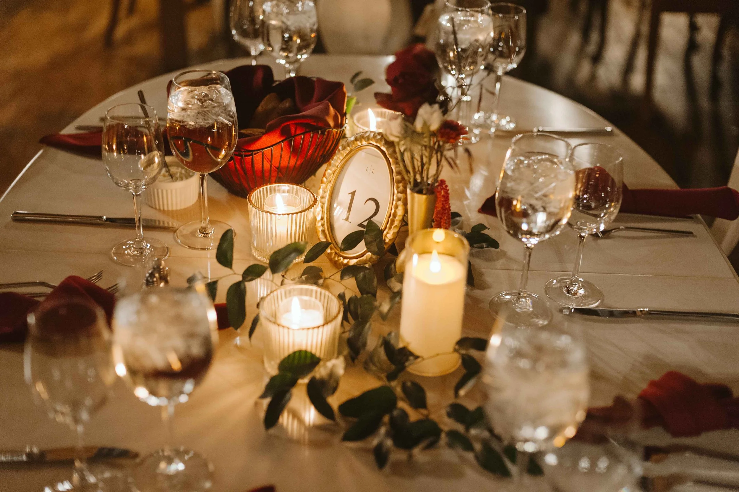 salvage one chicago wedding reception table decor greenery and table number in gold frame