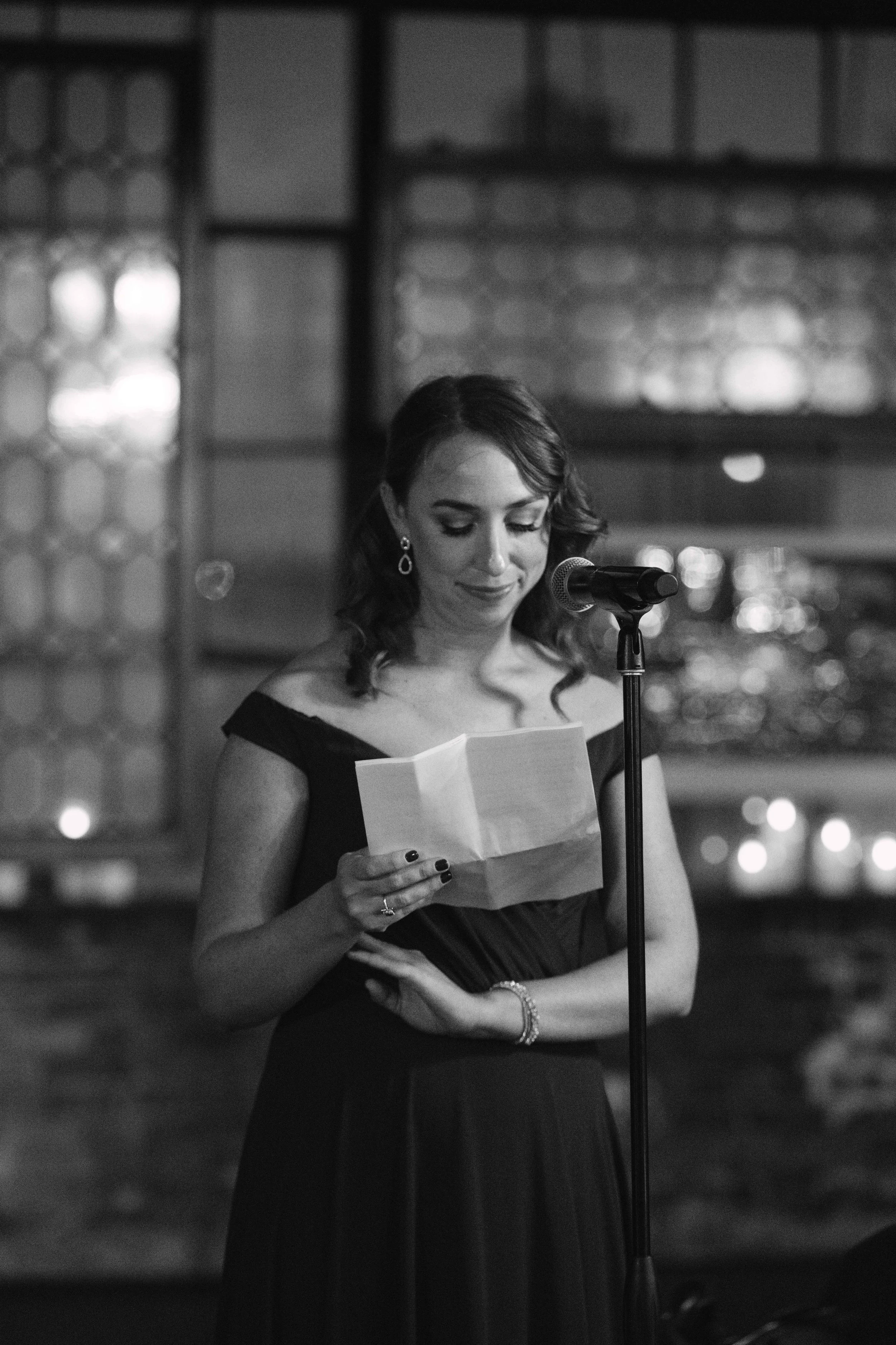 salvage one chicago wedding reception black and white shot of maid of honor giving her speech