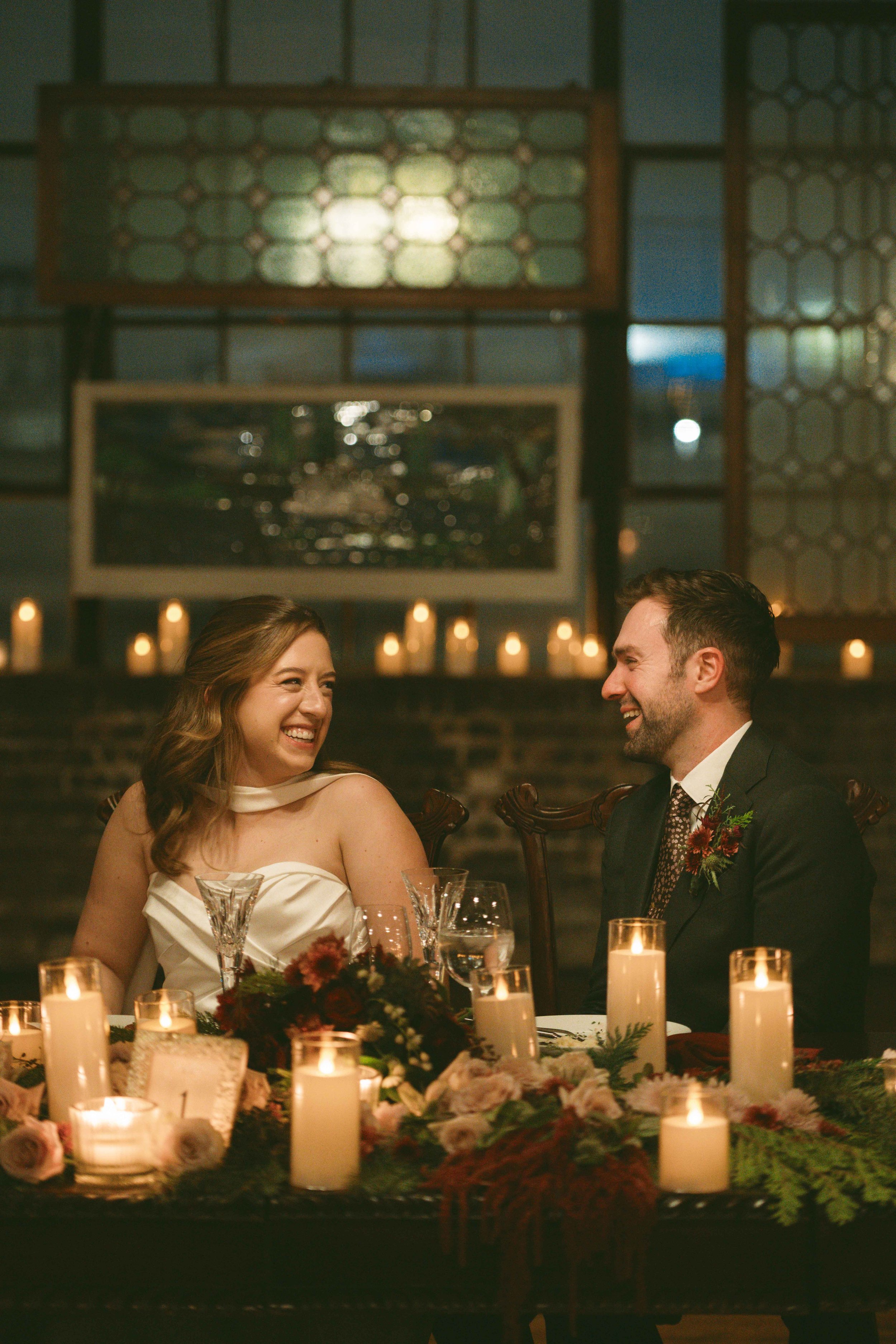 salvage one chicago wedding reception bride and groom glancing at each other