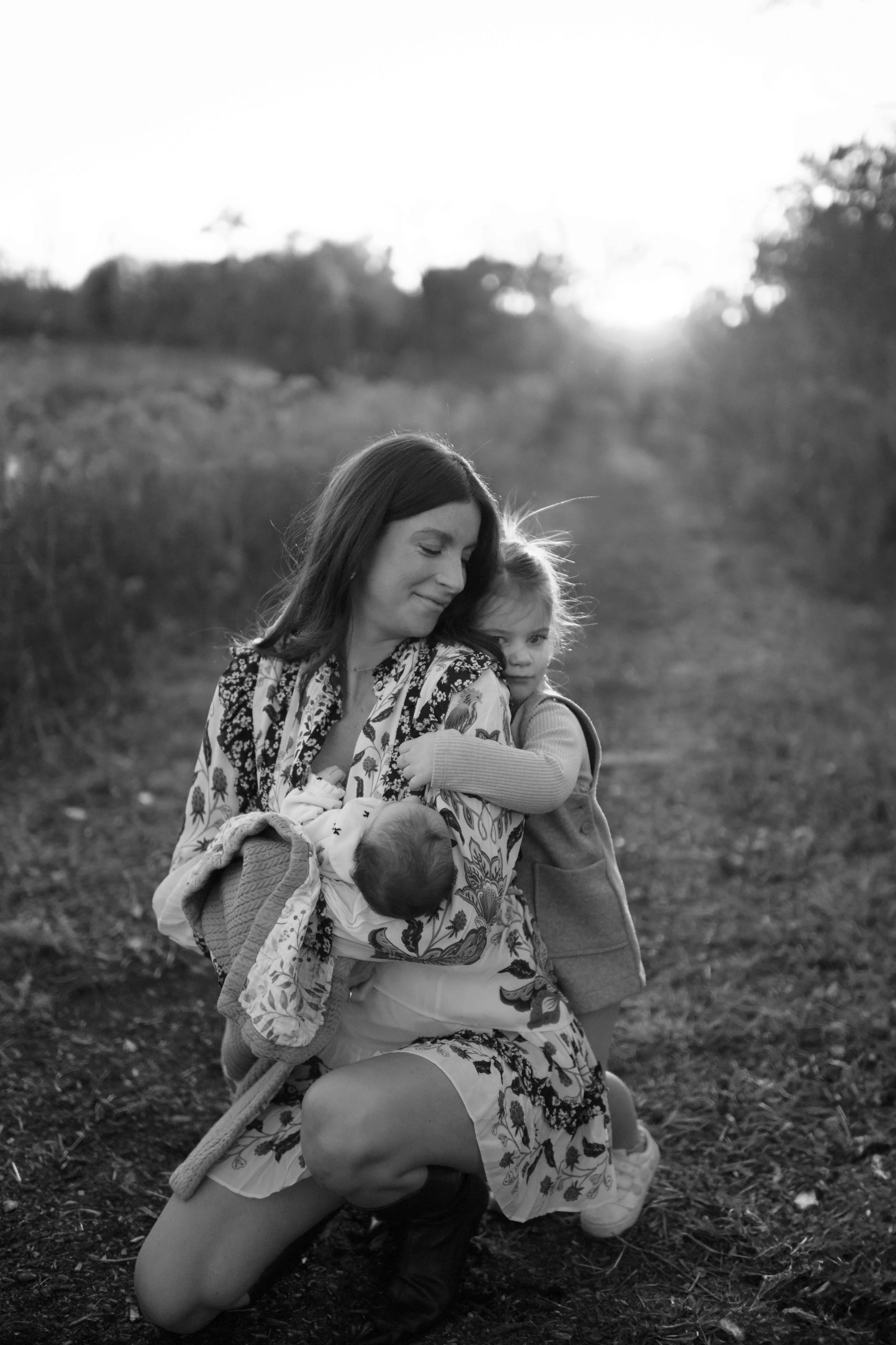 black and white photo daughter hugging mom from behind at the Morton Arboretum Lisle IL 