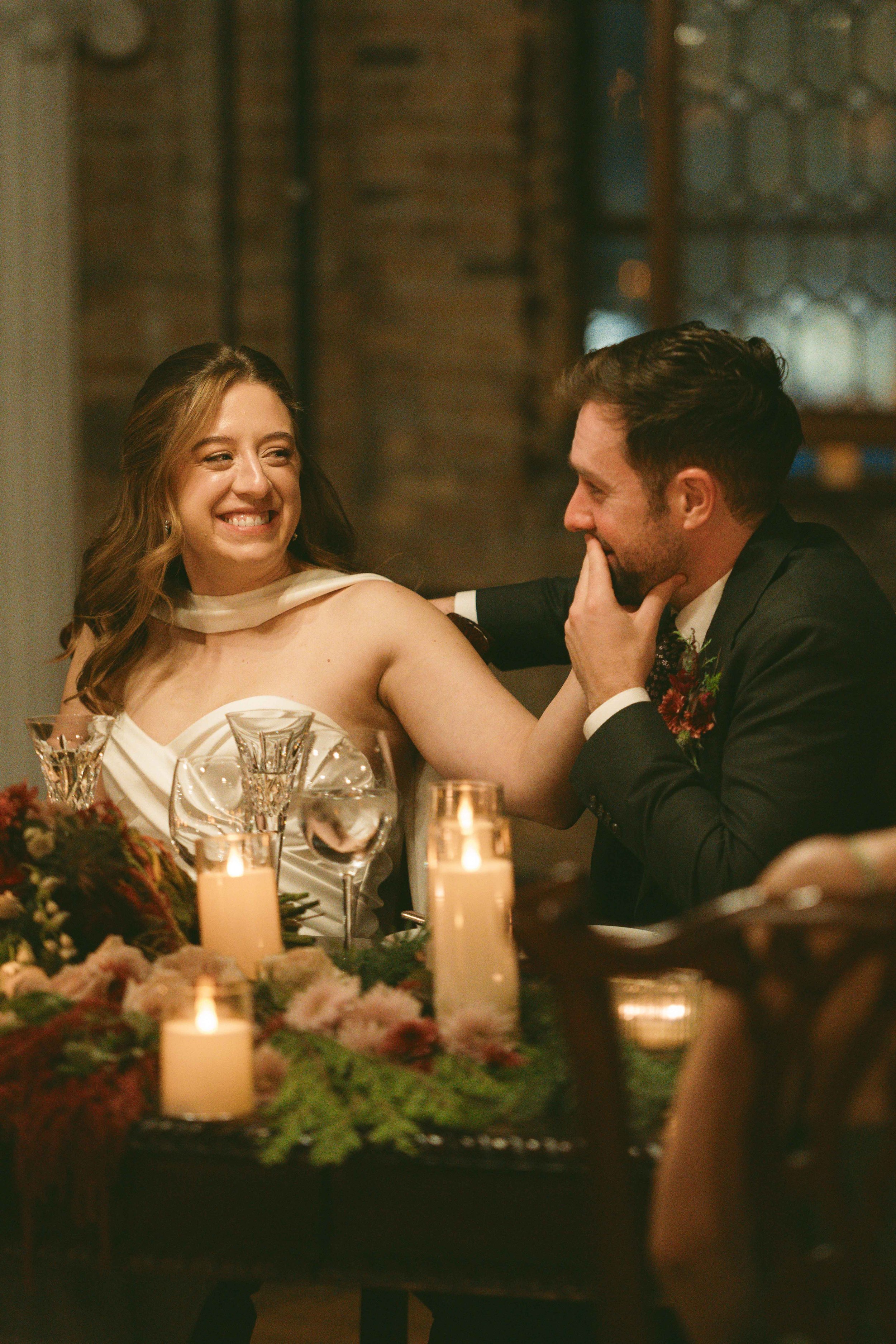 Salvage One Chicago wedding reception with a bride glancing at her groom