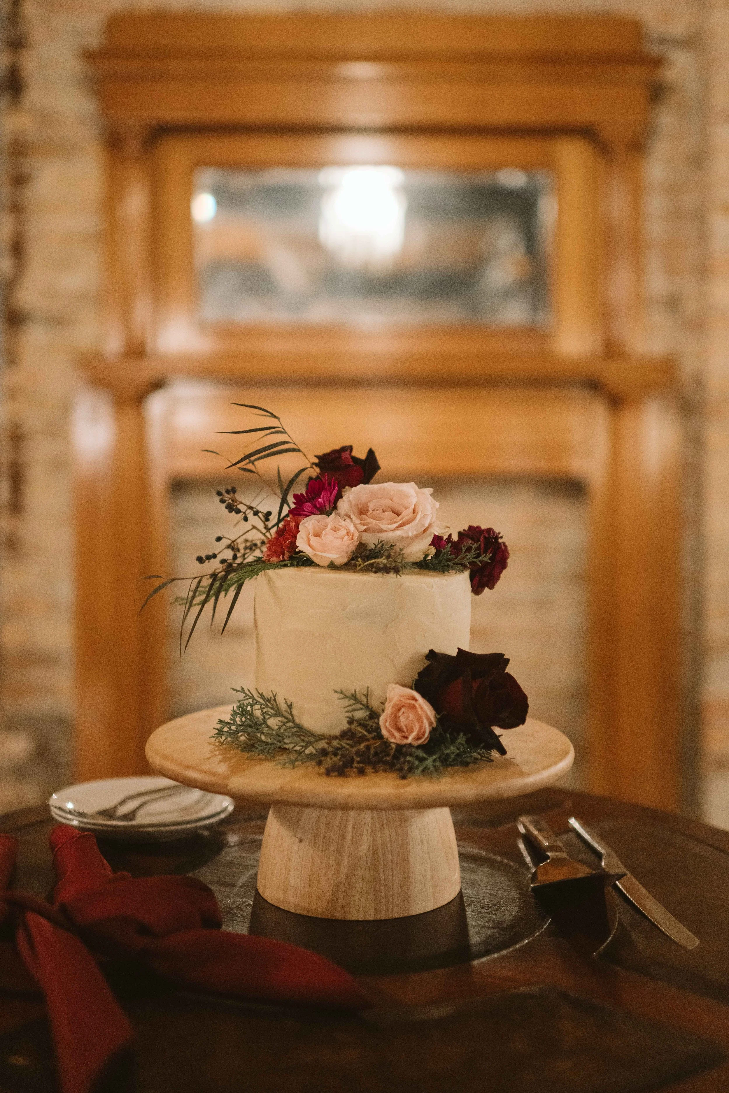 salvage one chicago wedding reception wedding cake with roses and greenery
