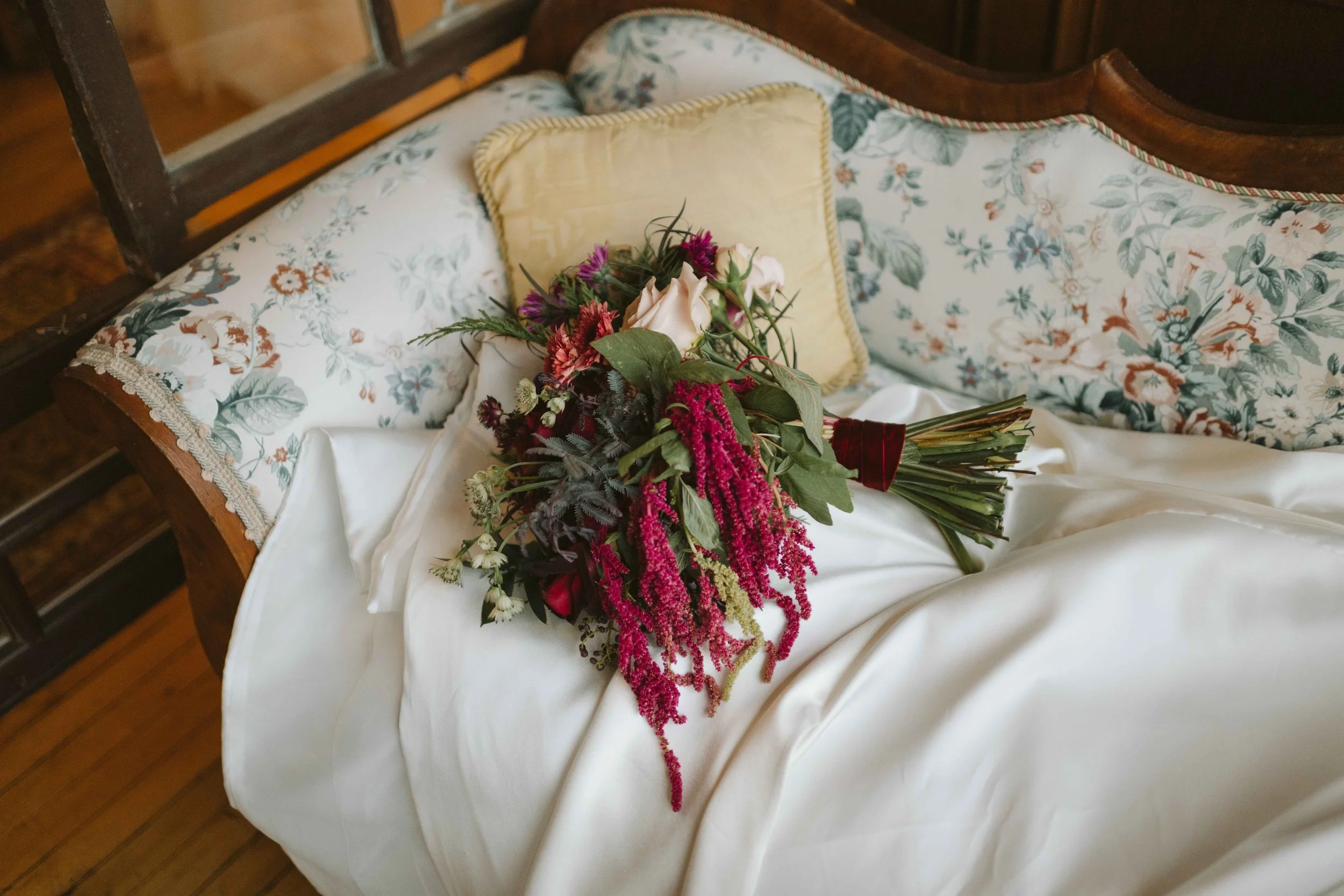 winter bouquet on floral couch at Salvage One in Chicago
