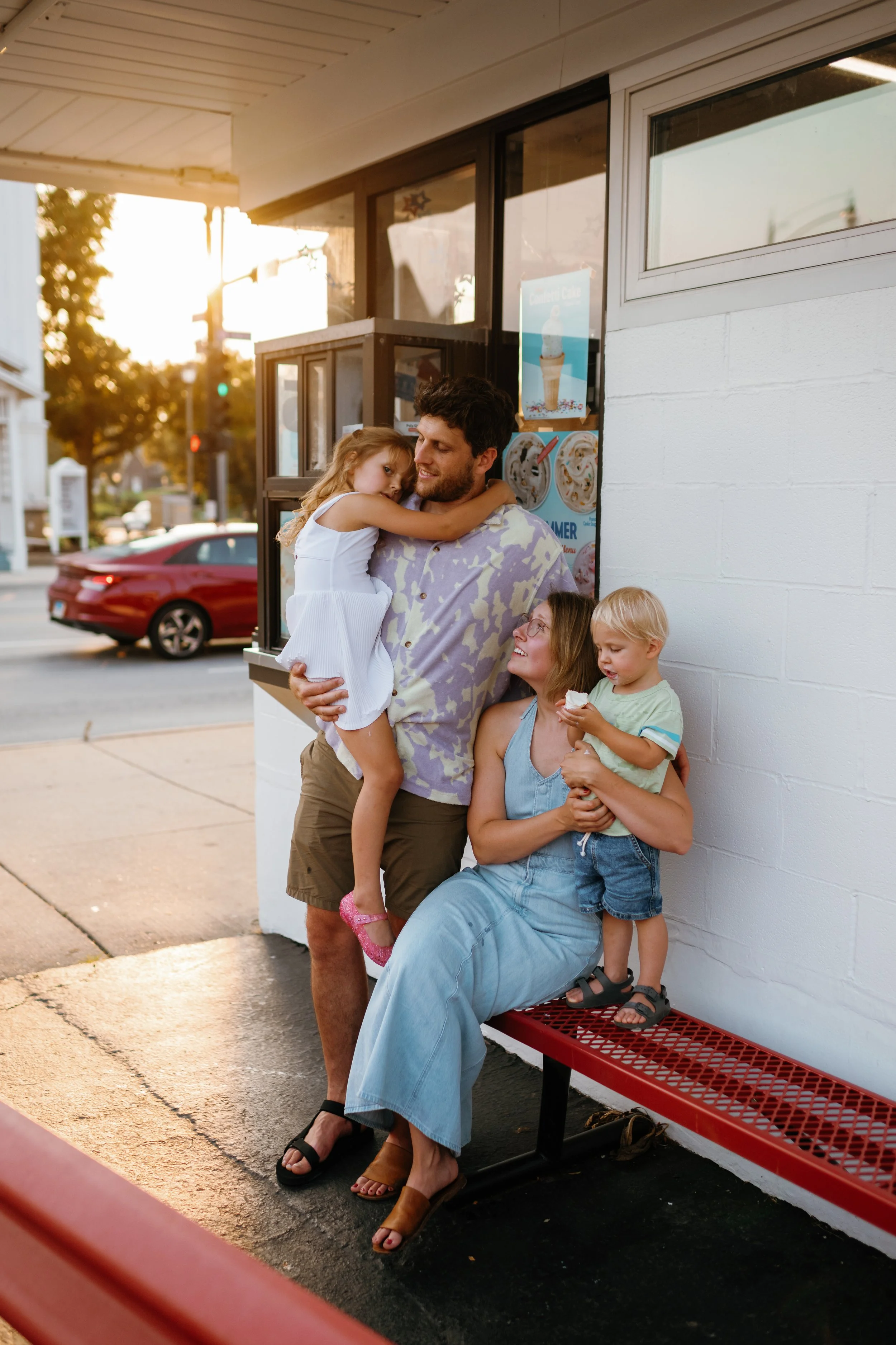 Family photo of 4 at Dairy Queen in the summer