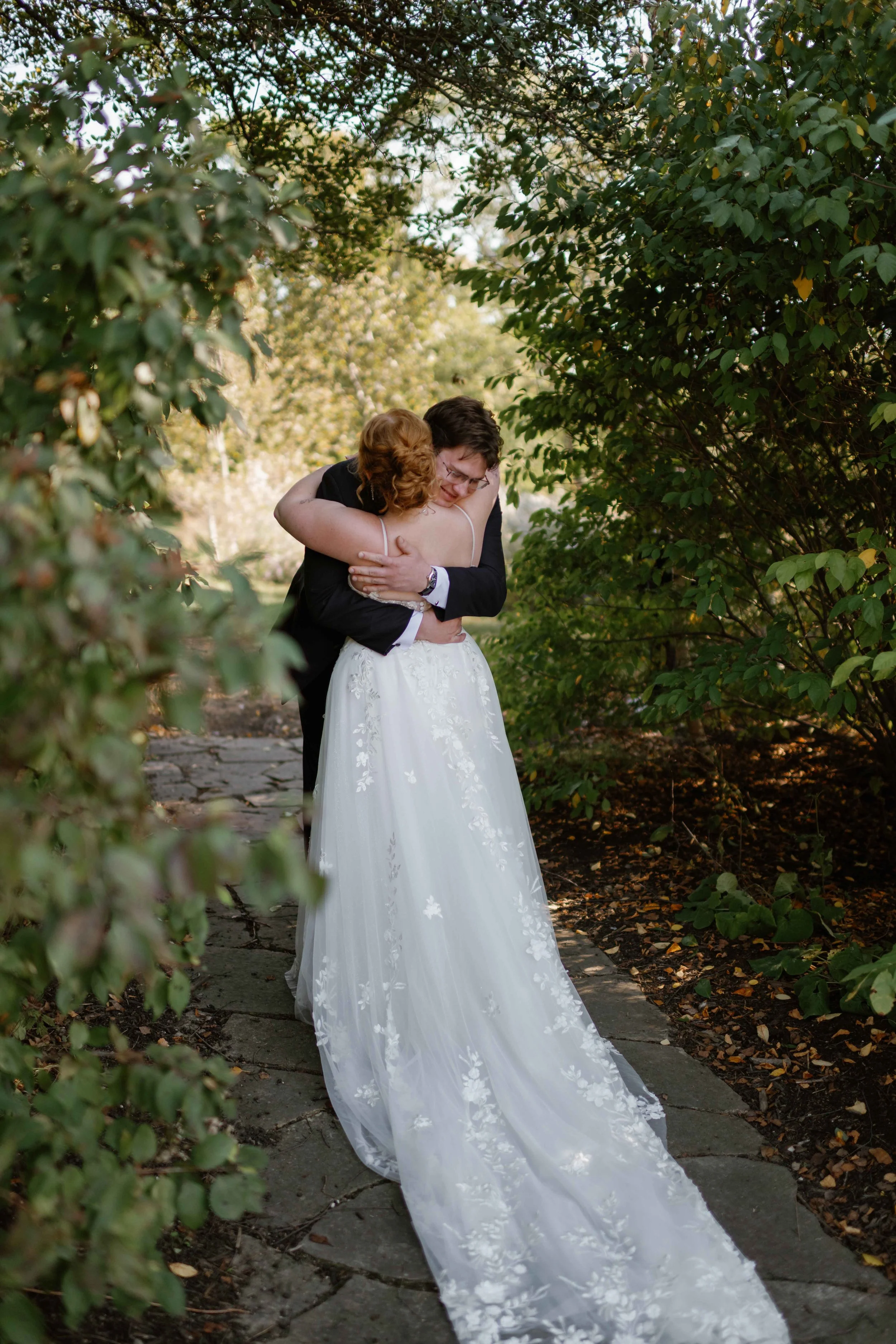 Bride and groom hugging after first look