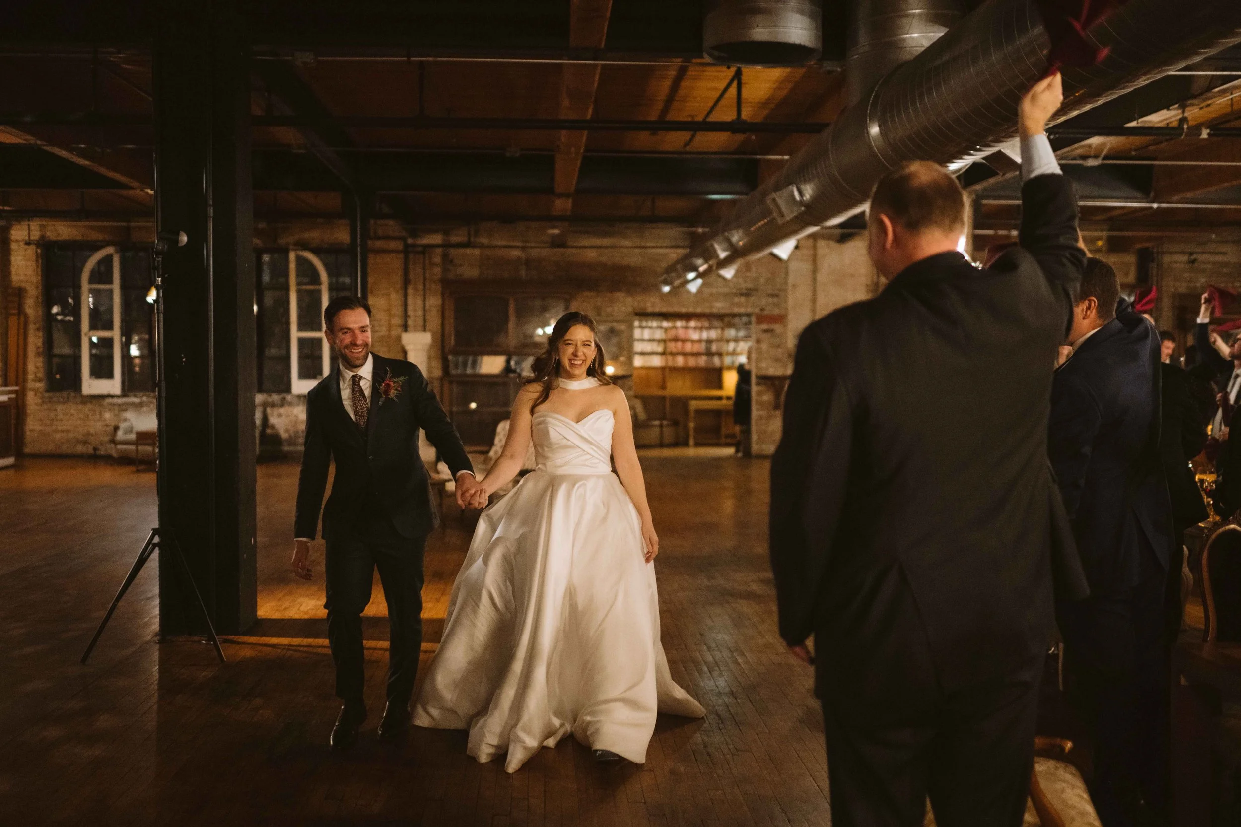 salvage one chicago wedding reception entrance of bride and groom