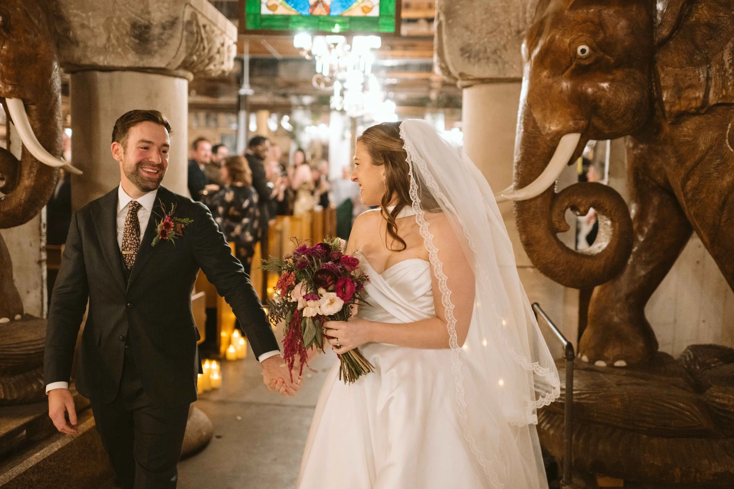 salvage one chicago iL wedding ceremony recessional bride and groom smiling at each other 