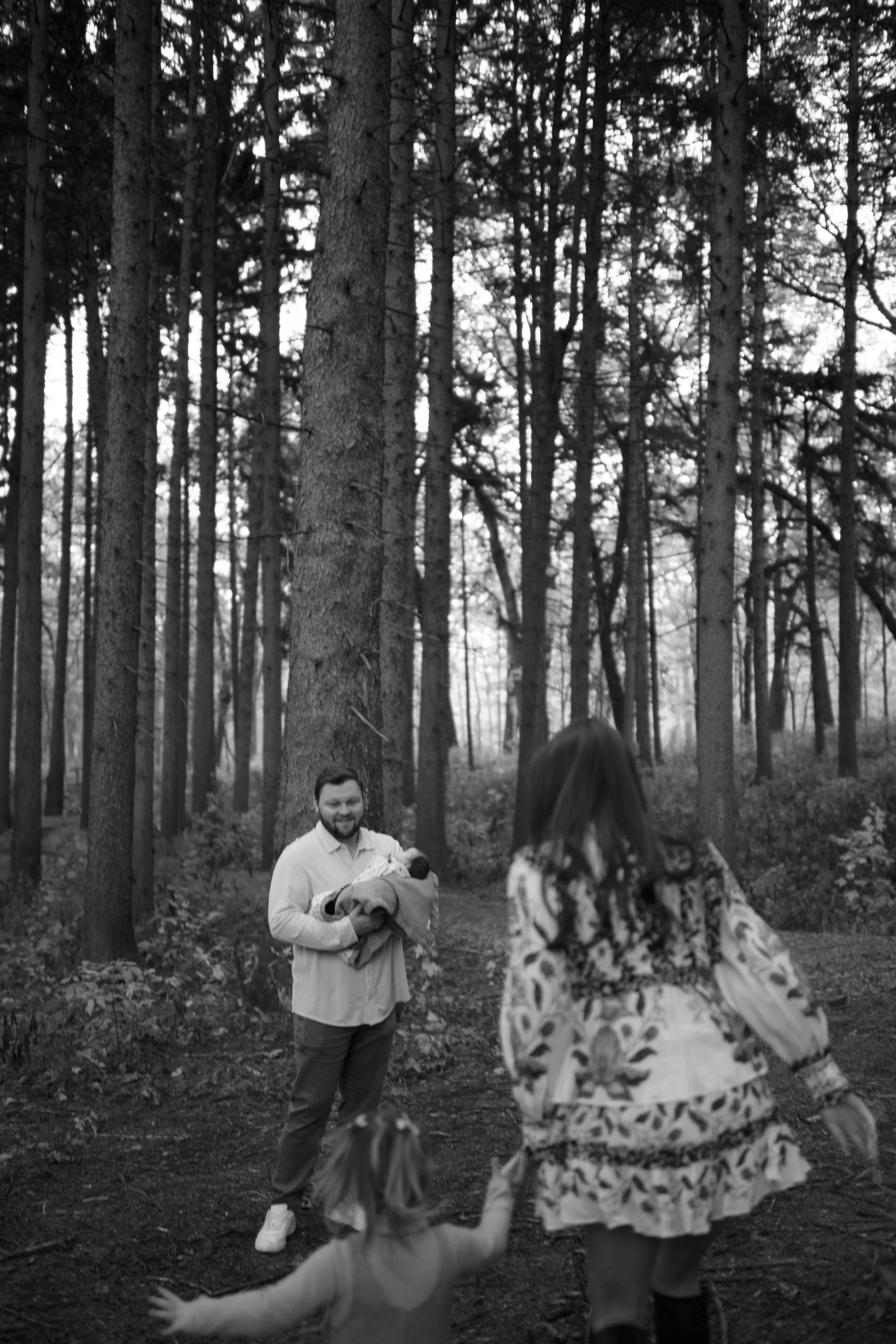 running towards daddy at family photos at Morton Arboretum Lisle IL 
