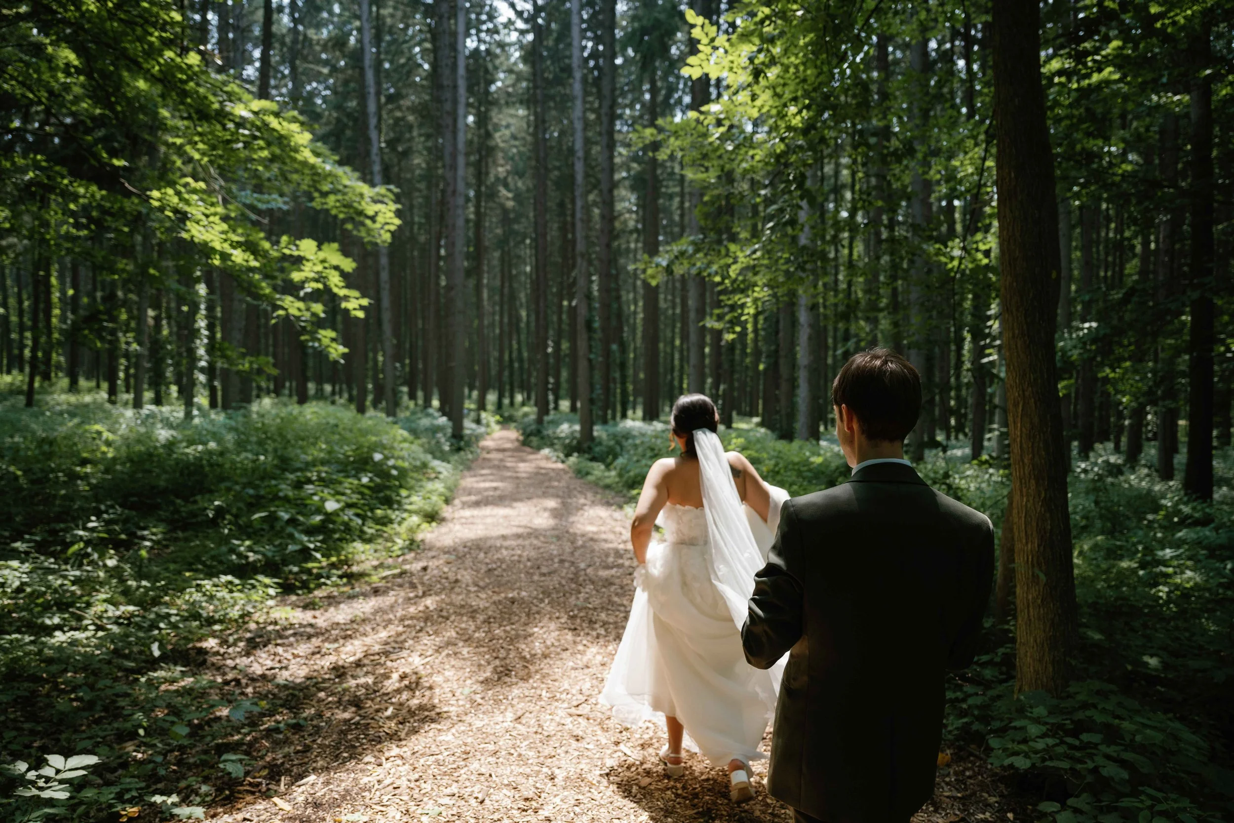 Bride and groom walking at The Morton Arboretum in Lisle Illinois