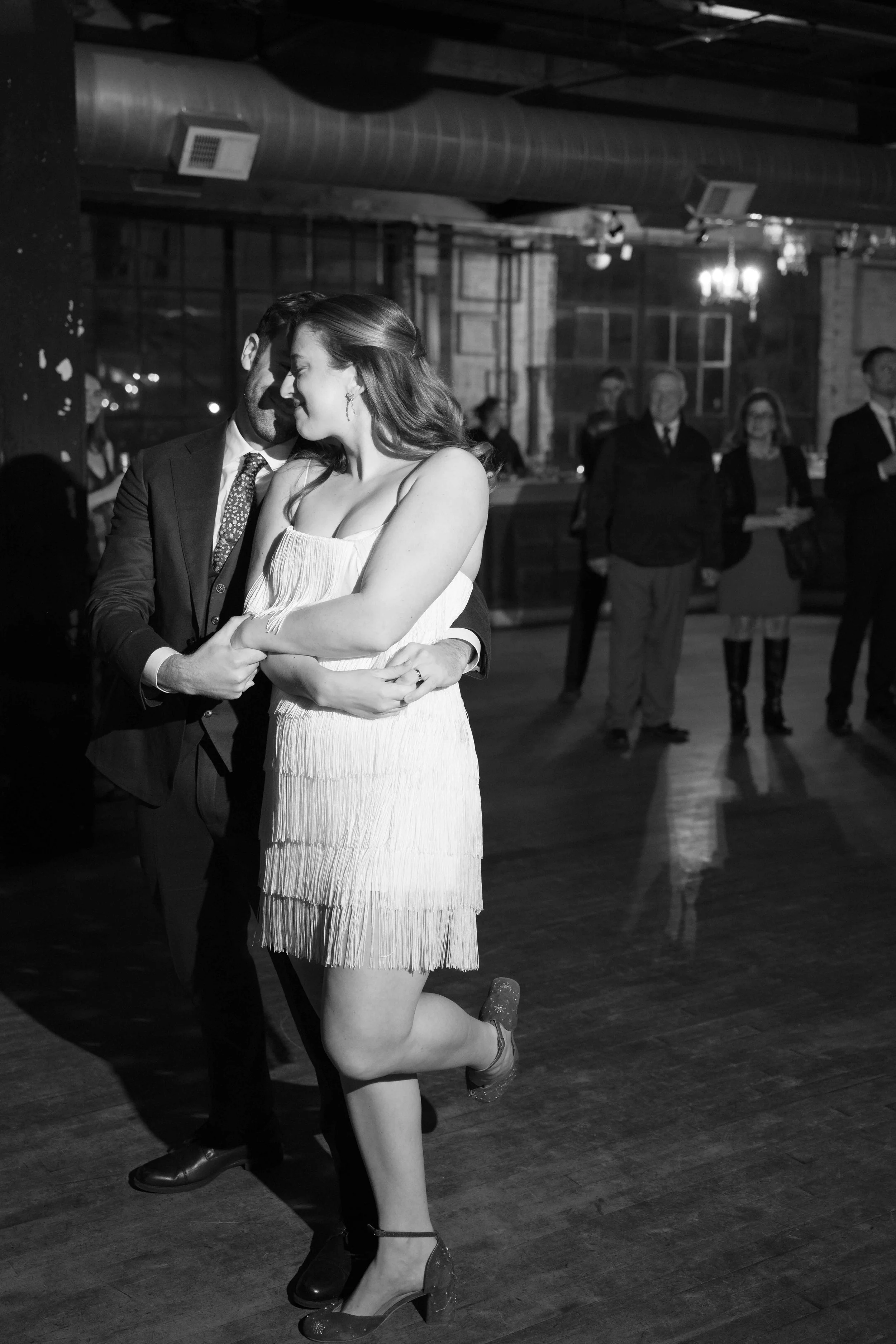 salvage one chicago wedding reception first dance of bride and groom with her dress change