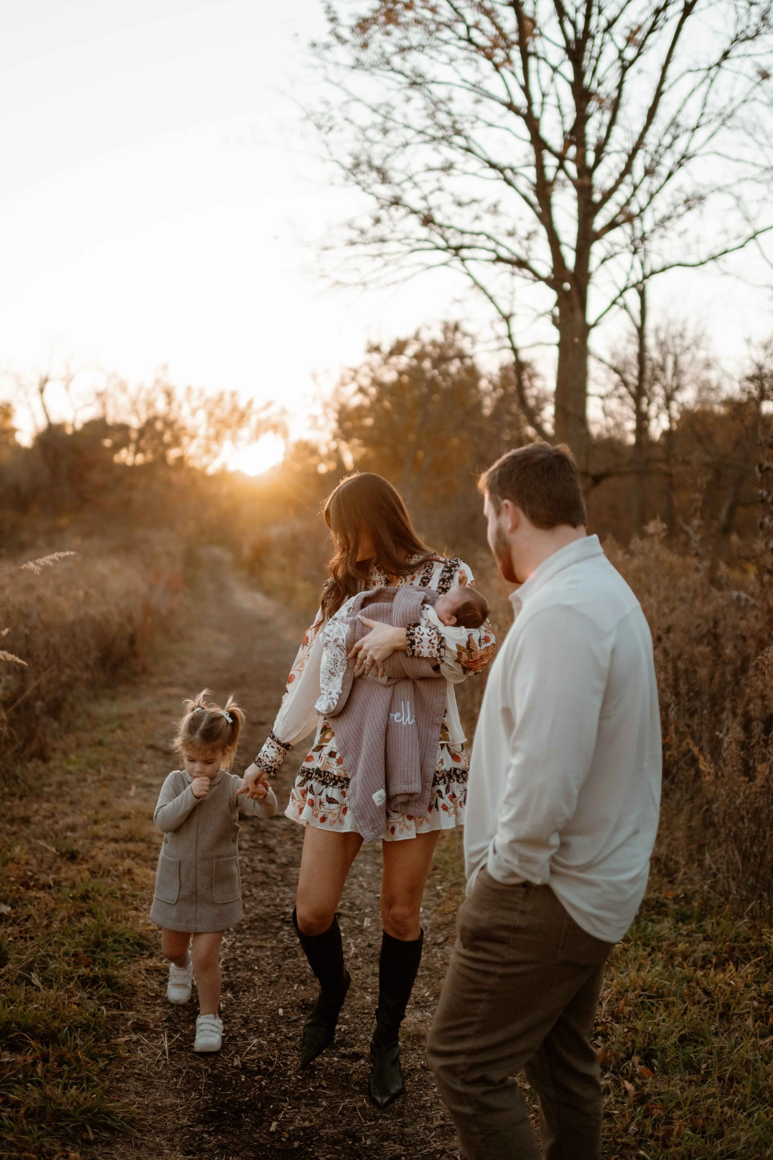 daughter sucking her thumb during family photos at sunset at the Morton Arboretum Lisle IL 