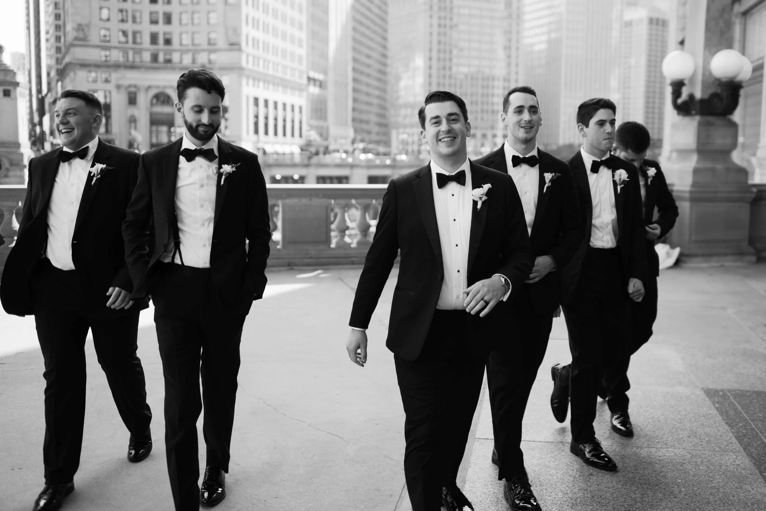 Downtown Chicago photo of groomsmen walking in black and white