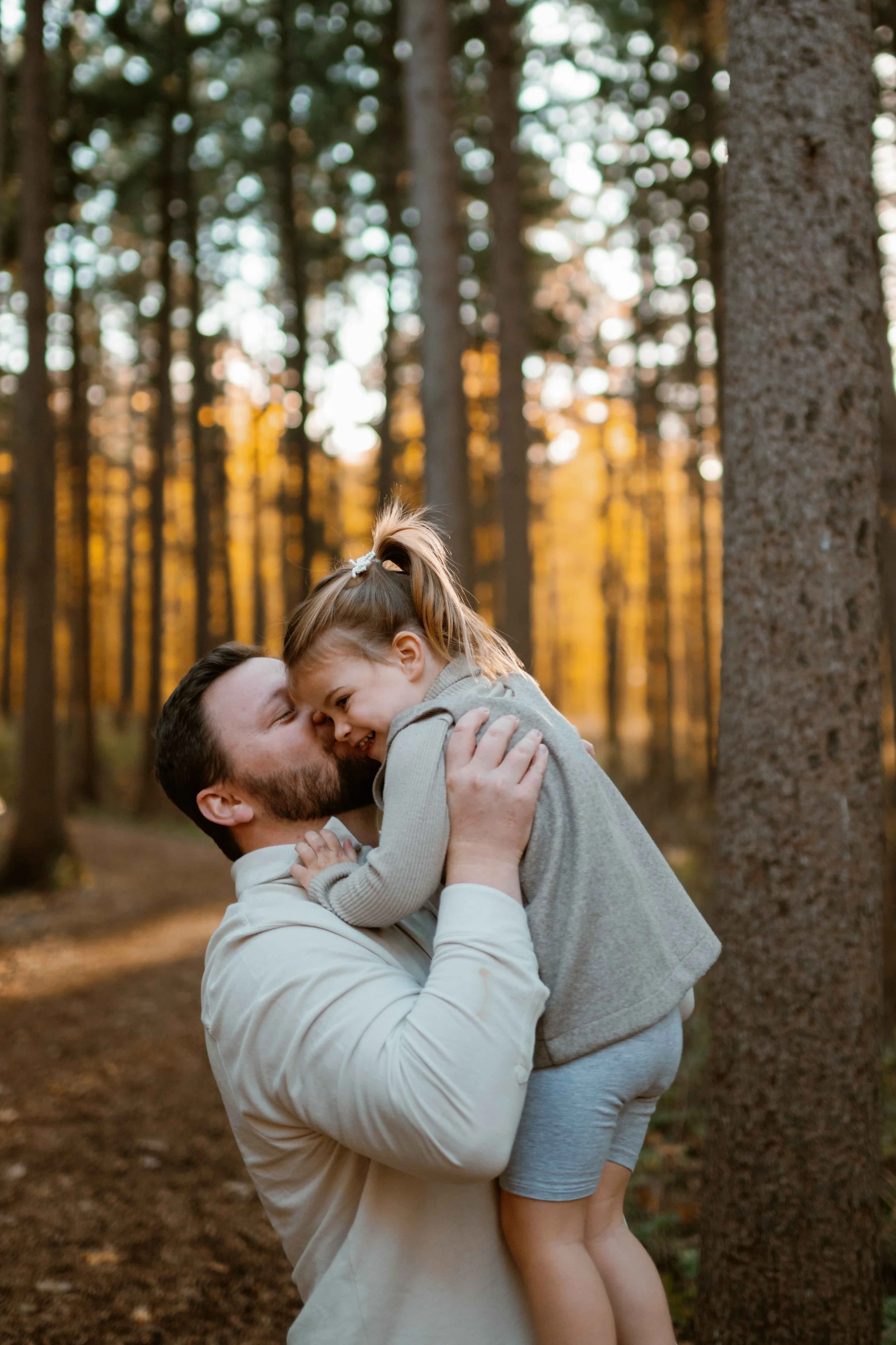 daughter nuzzling dad at Morton Arboretum Lisle IL 