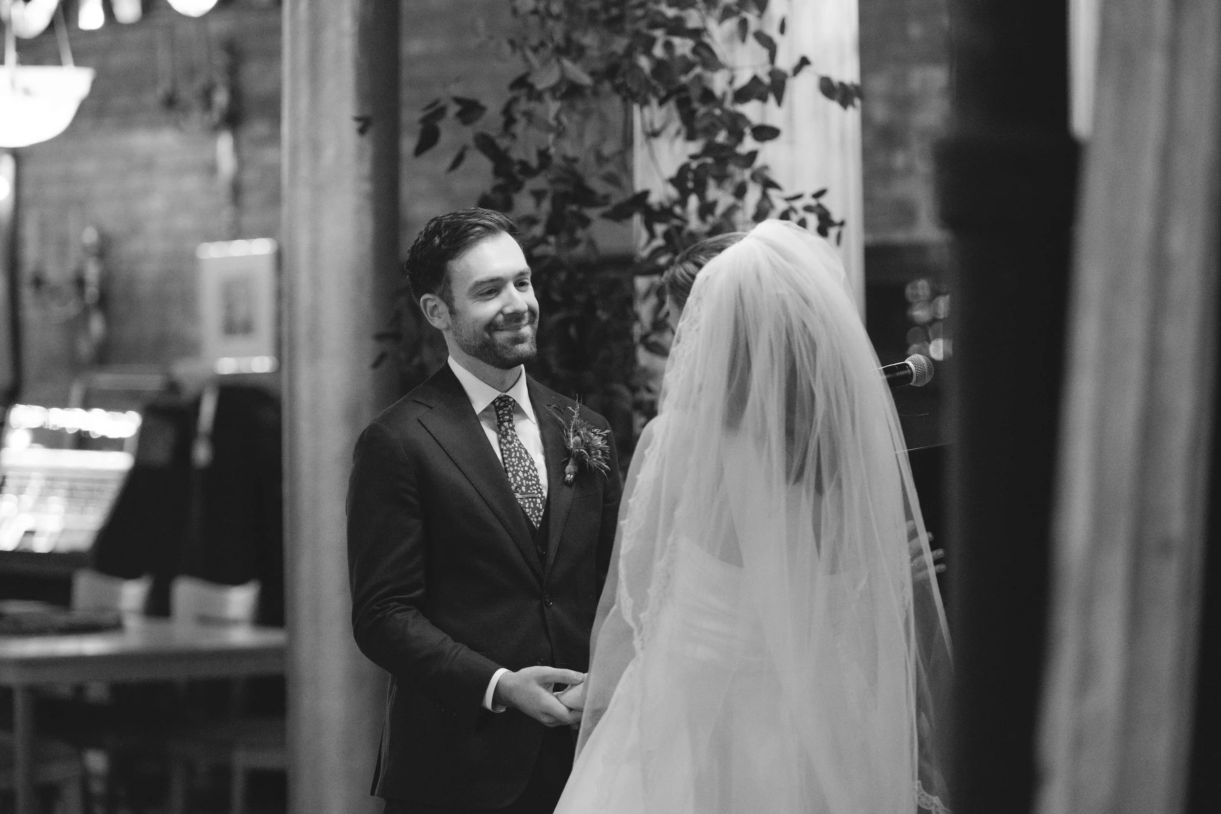 salvage one chicago IL groom looking at bride during wedding ceremony black and white
