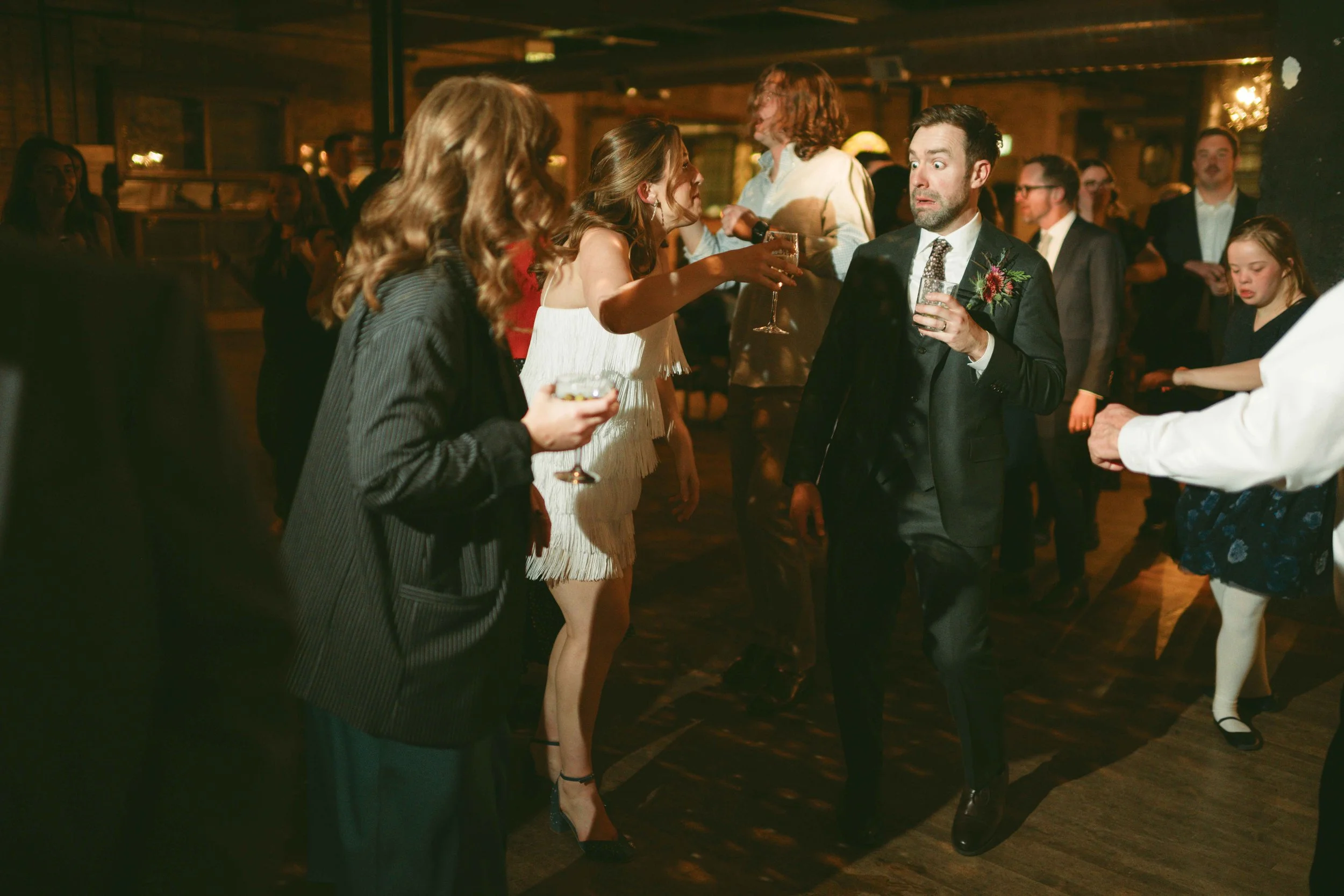 salvage one chicago wedding reception dancing groom funny expression