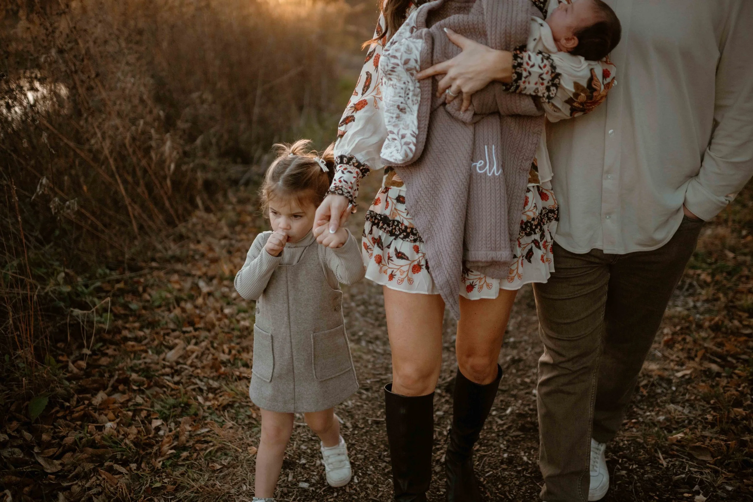close up of daughter sucking her thumb on walk at the Morton Arboretum Lisle IL 