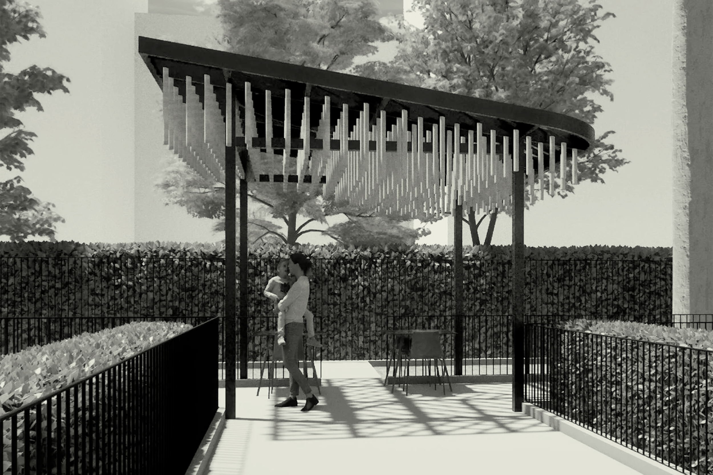 Black and white photo of a modern architectural structure with vertical slats, a sloped roof, trees in the background, and two people standing in the foreground, one of whom is holding a cane.