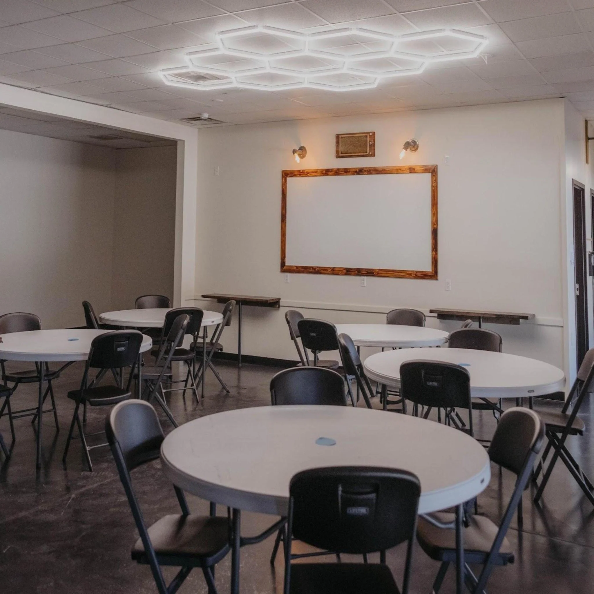 Tables and gathering space inside Ignite Day Services.