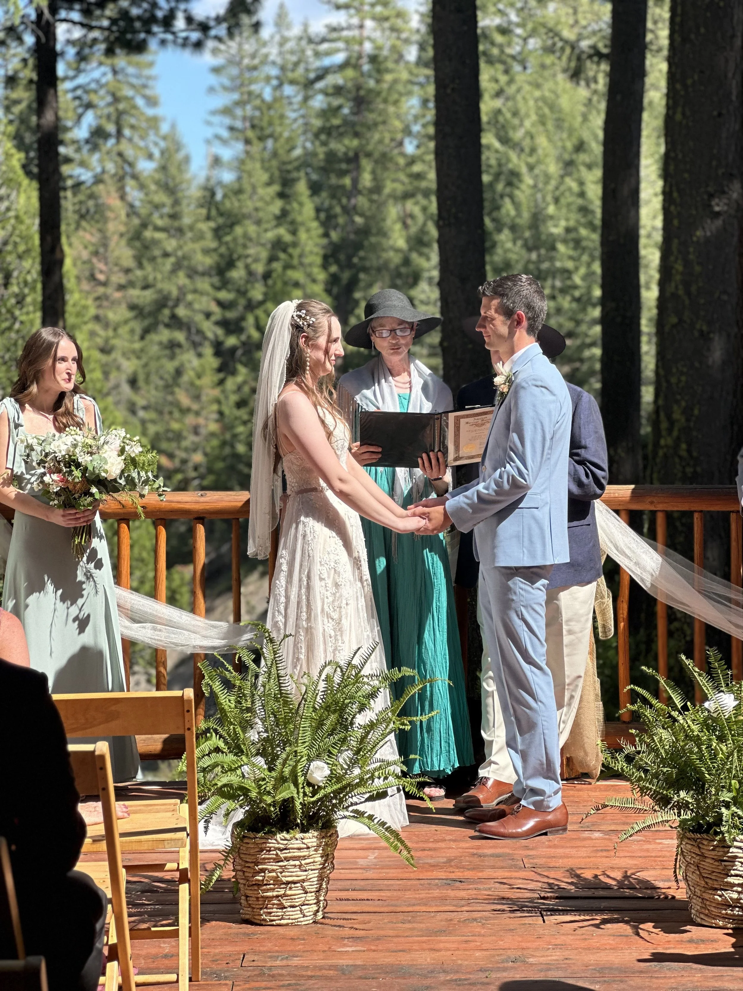 Outdoor wedding ceremony setup in forest setting