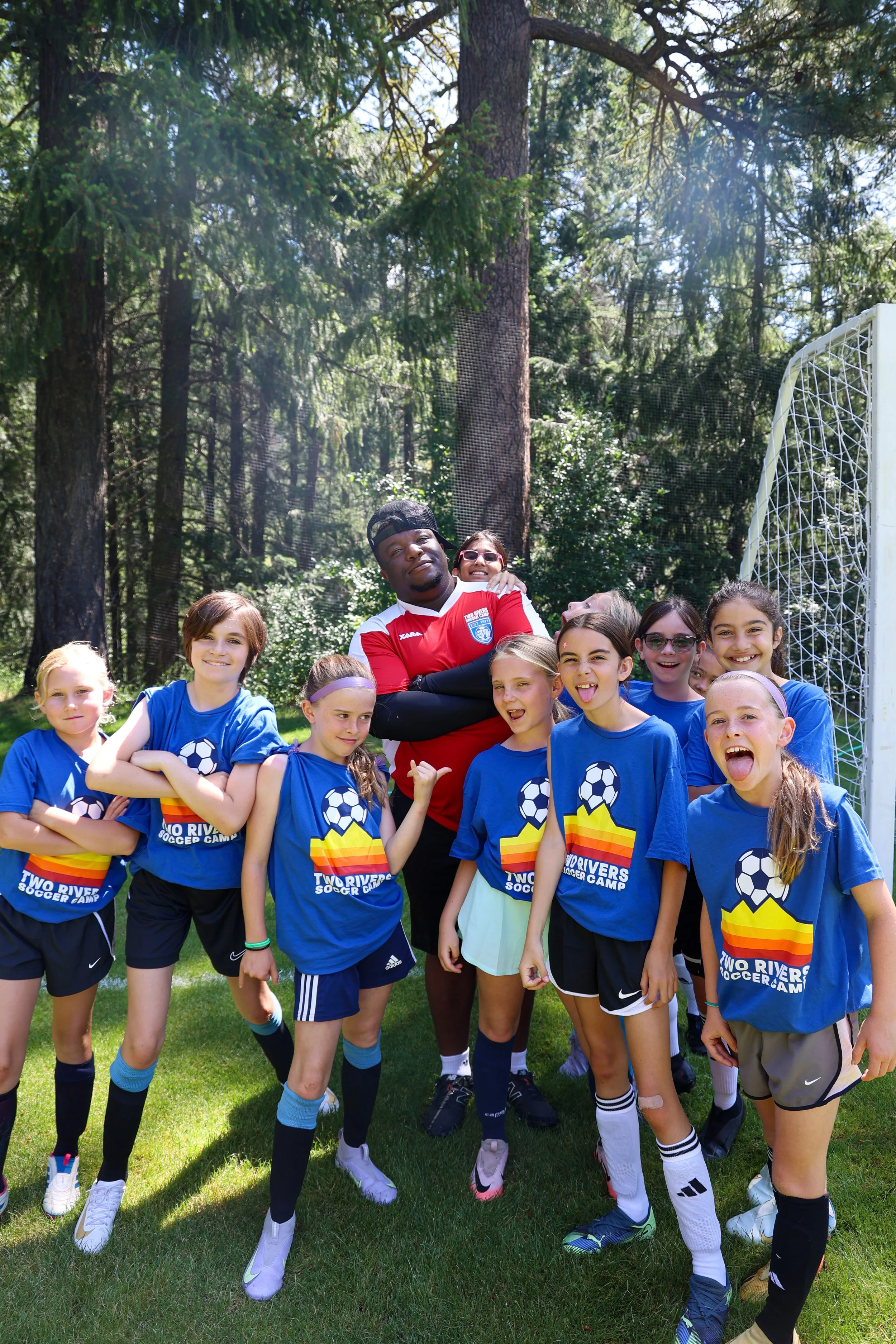Campers posing together in the Sierra mountains during summer soccer camp experience