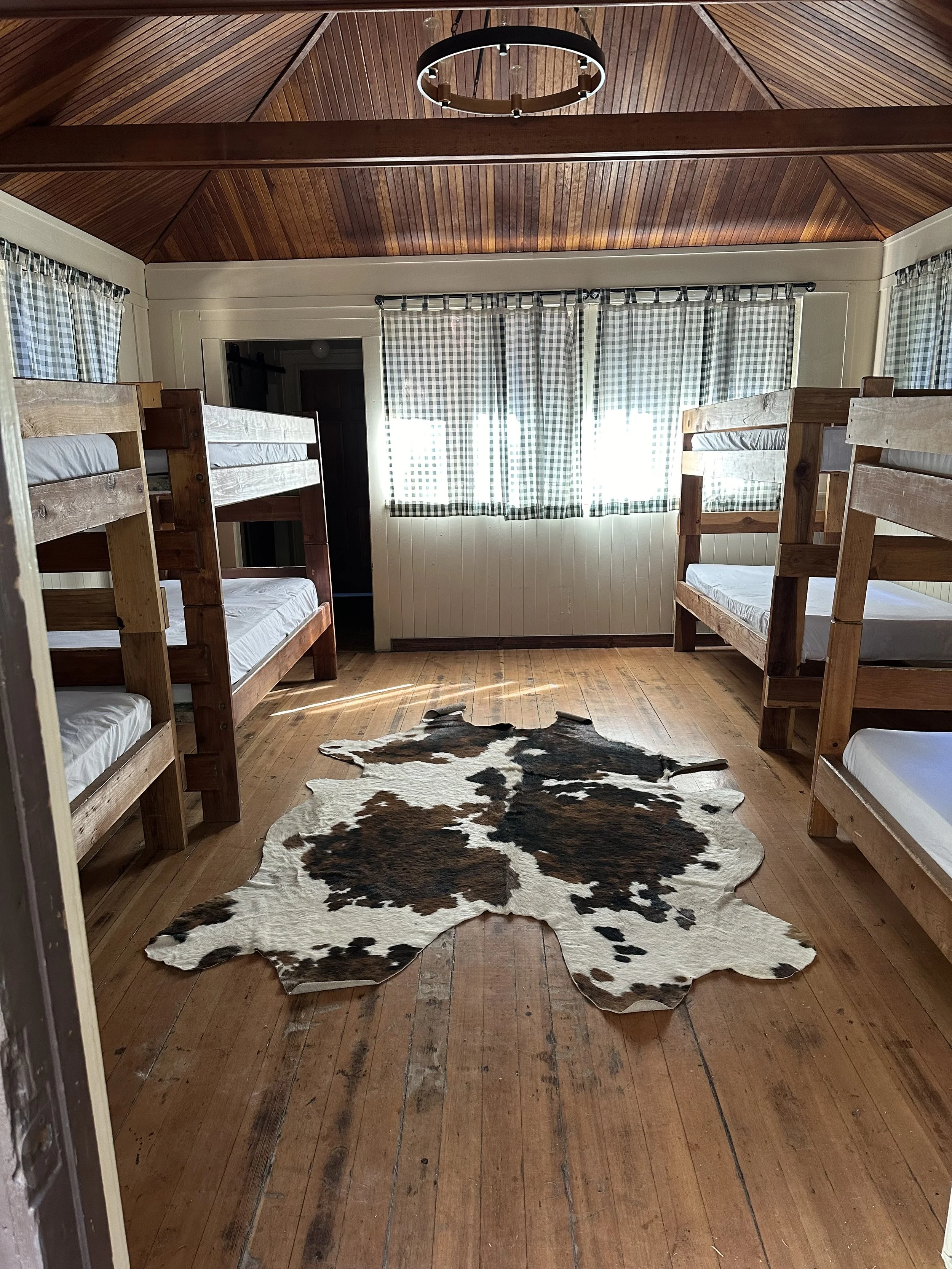 Rustic cabin accommodations at Two Rivers camp