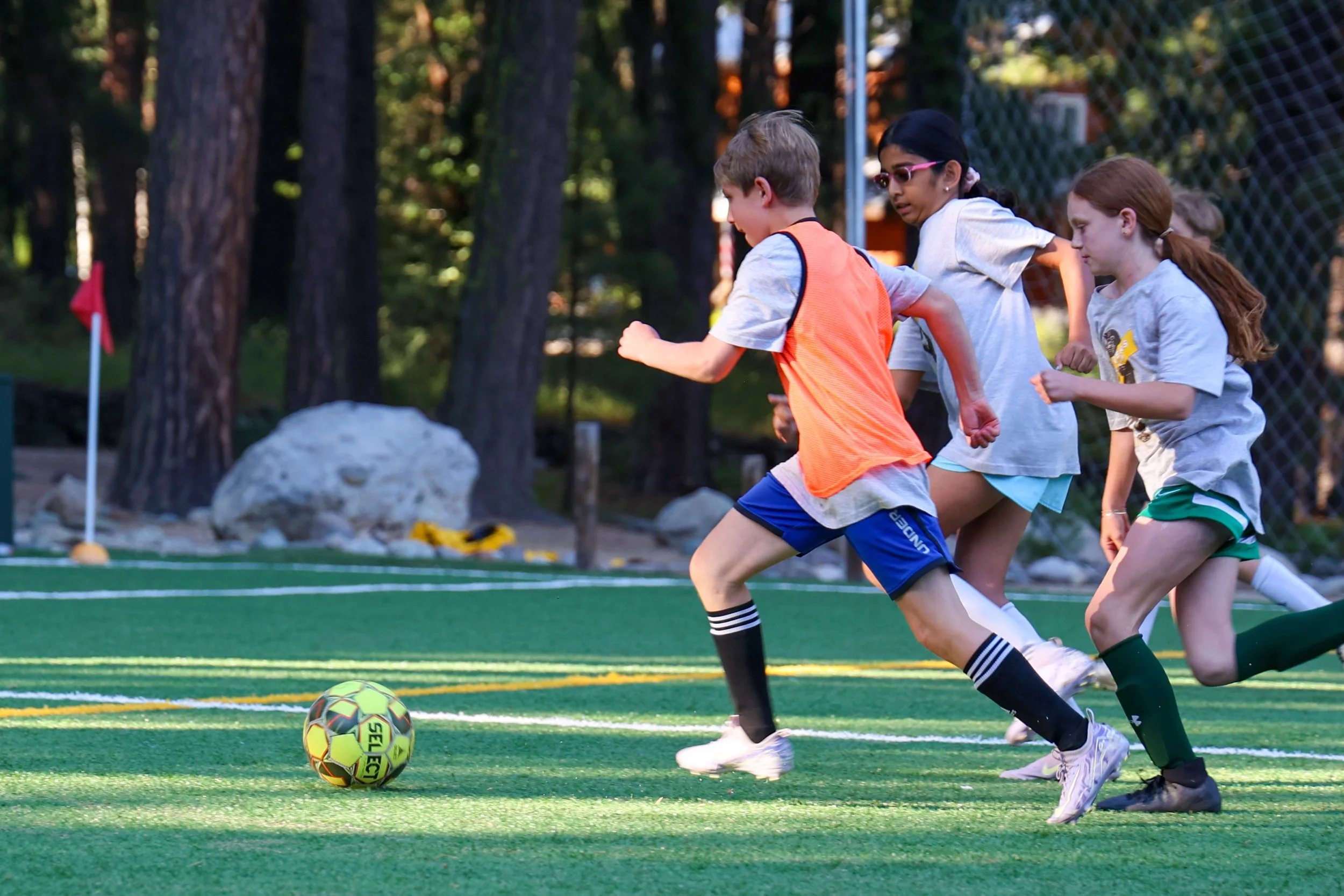 Campers participating in soccer training sessions