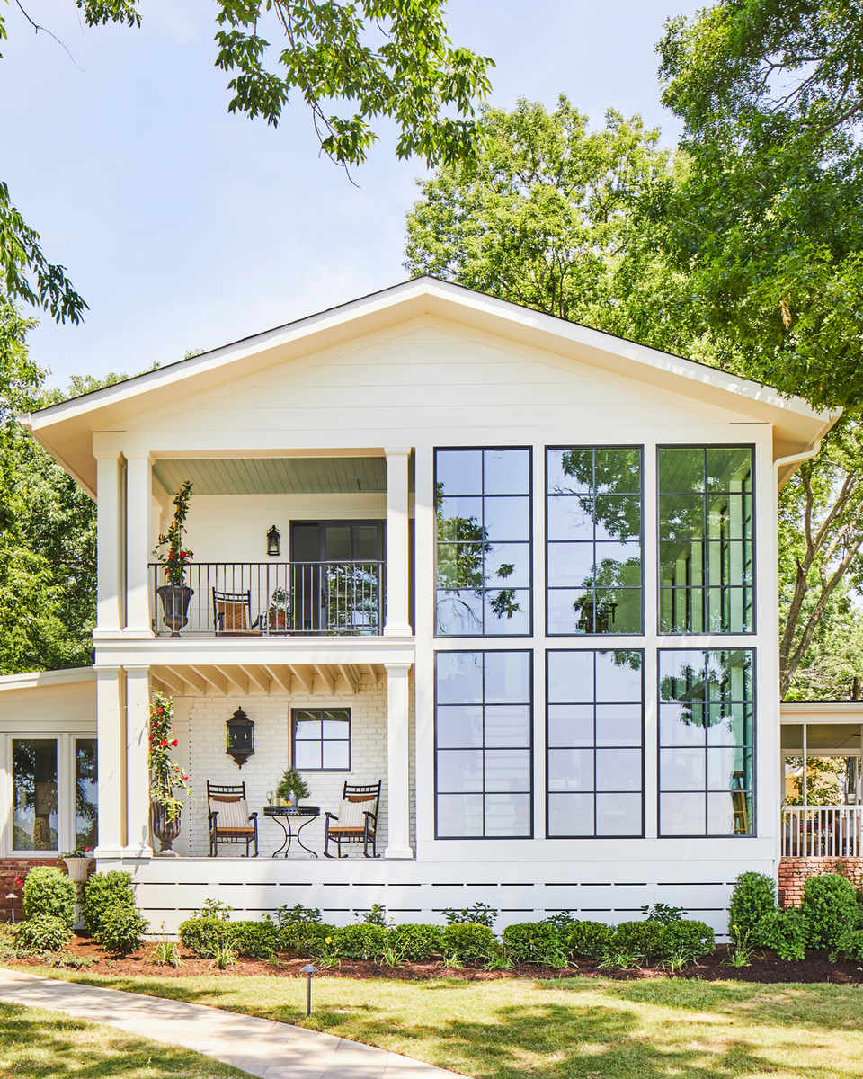 A modern two-story house in Brentwood, Tennessee with large glass windows from Pella.