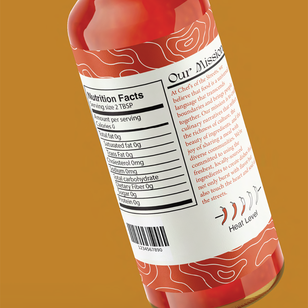 A beverage bottle with a nutrition facts label, a barcode, and a description about the brand's mission, including a heat level indicator with four chili peppers.