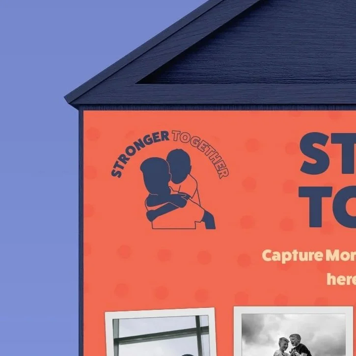 Close-up of a red poster on a blue wall with an illustration of two children hugging, and the words "Stronger Together" above it.