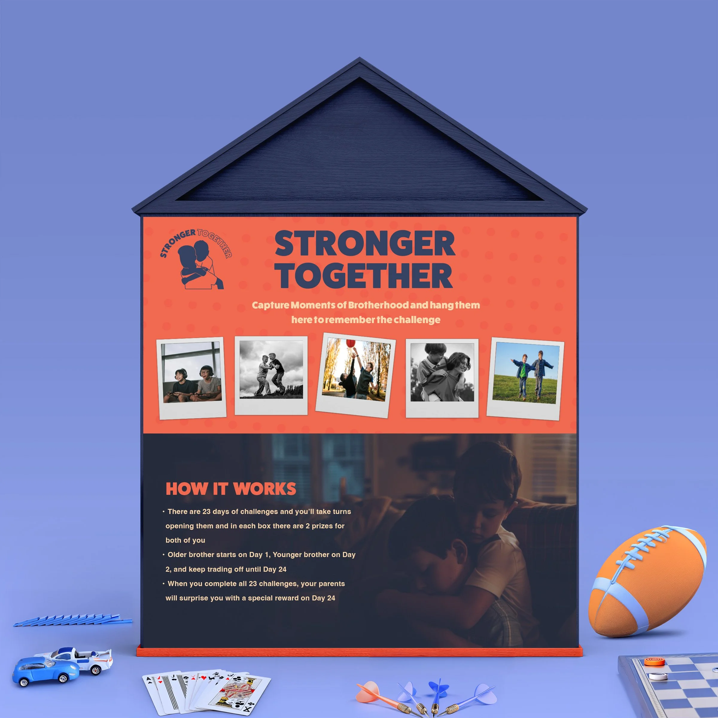 A house-shaped display promoting a 'Stronger Together' challenge, featuring photos of children, instructions for participating over 23 days, and decorative toy cars, a football, darts, and a checkerboard at the base.