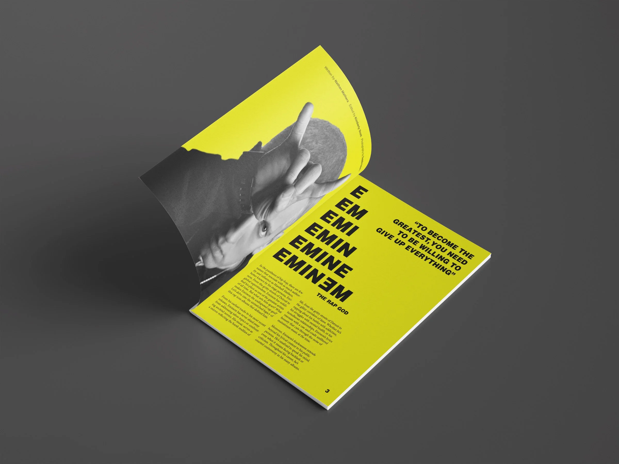 An open magazine featuring a black and white photo of a person making a peace sign with their hand and holding a rock, with vibrant yellow pages displaying bold text including names and motivational quotes.