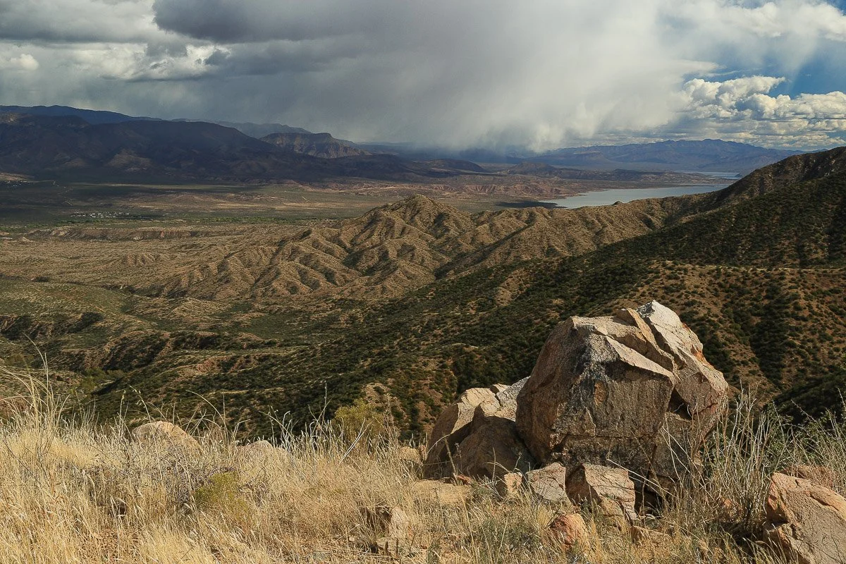 Angular boulders and dry grass await an Autumn storm in the southern Mazatzal Mountains near Sycamore Creek, close-up. 