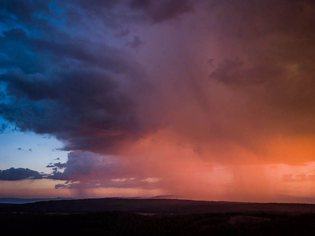 Pink sunset filters through a summer rainstorm near Strawberry. 