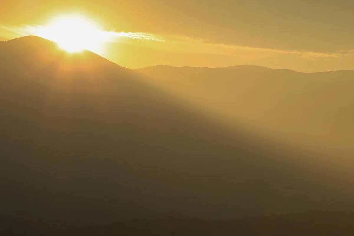 Golden sunrise through morning haze near Gisela. 